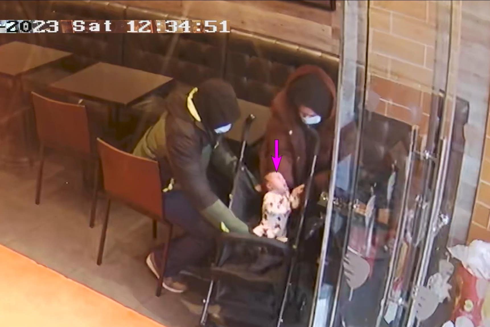 Constance Marten, Mark Gordon and baby Victoria in a shop in East Ham, London. This was shown in court during their trial