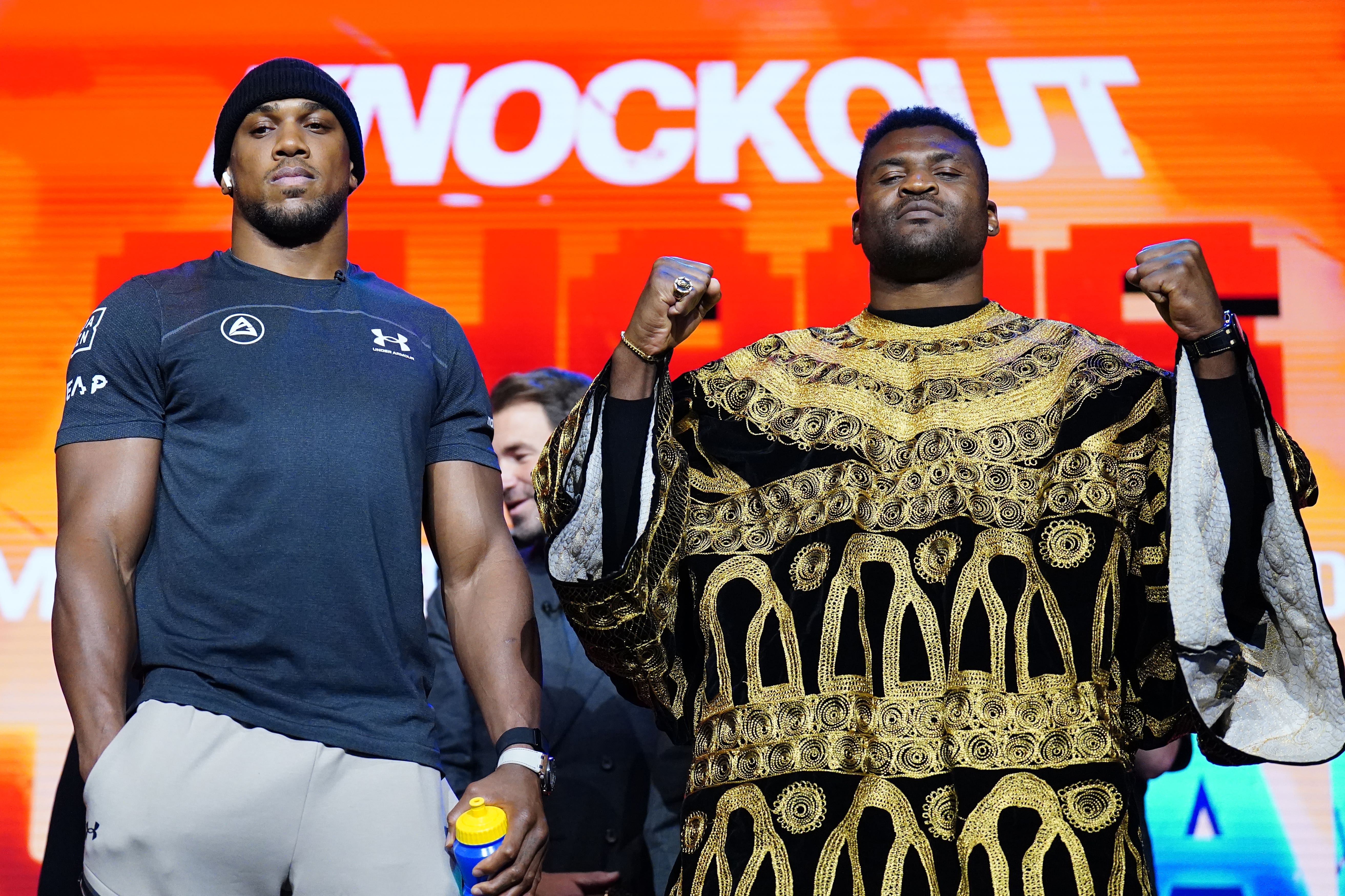 Anthony Joshua, left, weighed in at almost two stones lighter than Francis Ngannou, right (Zac Goodwin/PA)