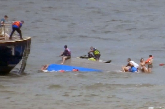 All 13 people on board the boat were thrown overboard during the capsizing