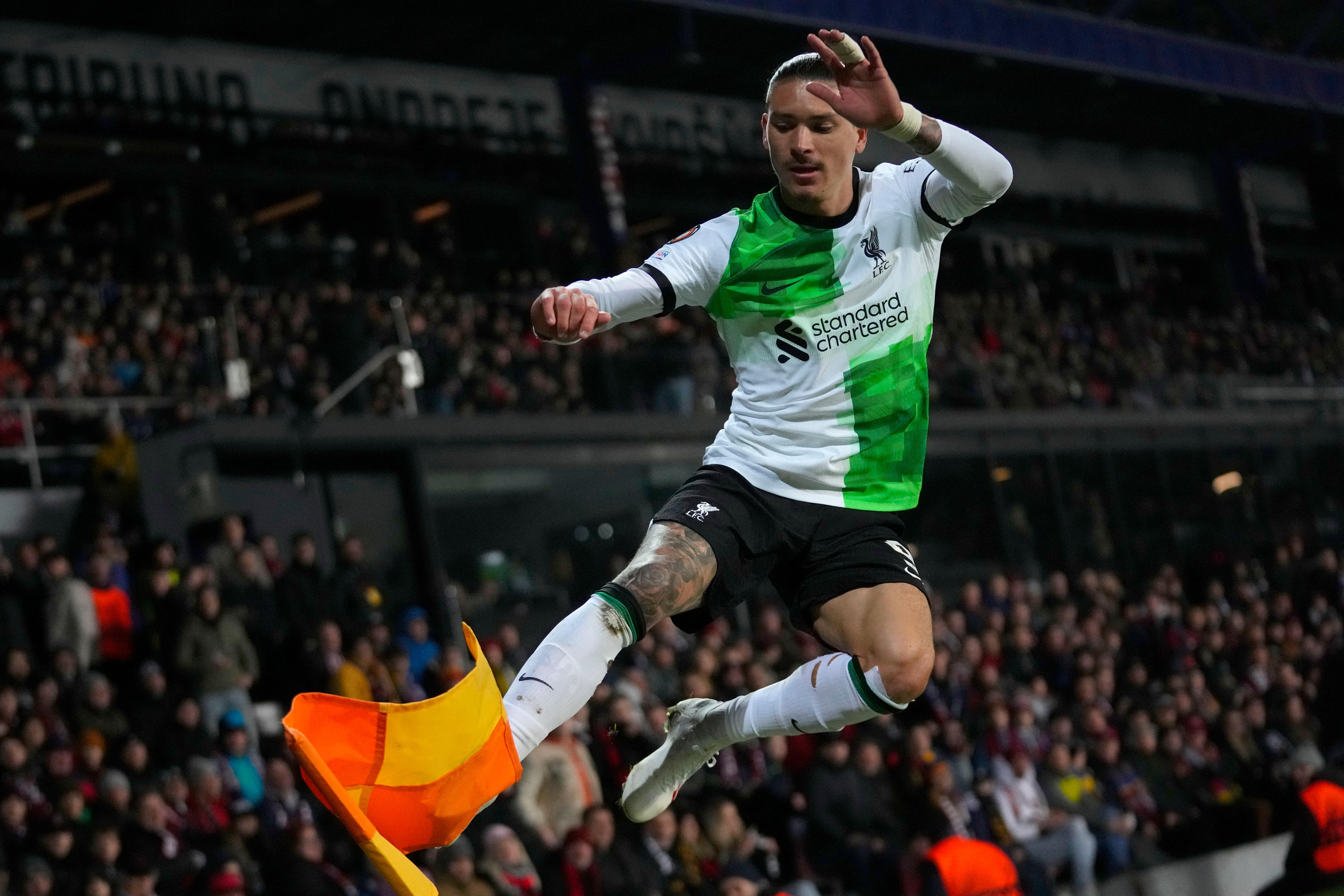 Liverpool’s Darwin Nunez kicks the corner flag as he celebrates fater scoring his sides third goal during the Europa League round of 16 first leg, soccer match between Sparta Praha and Liverpool at the Epet Arena in Prague, Czech Republic, Thursday, March 7, 2024. (AP Photo/Petr David Josek)