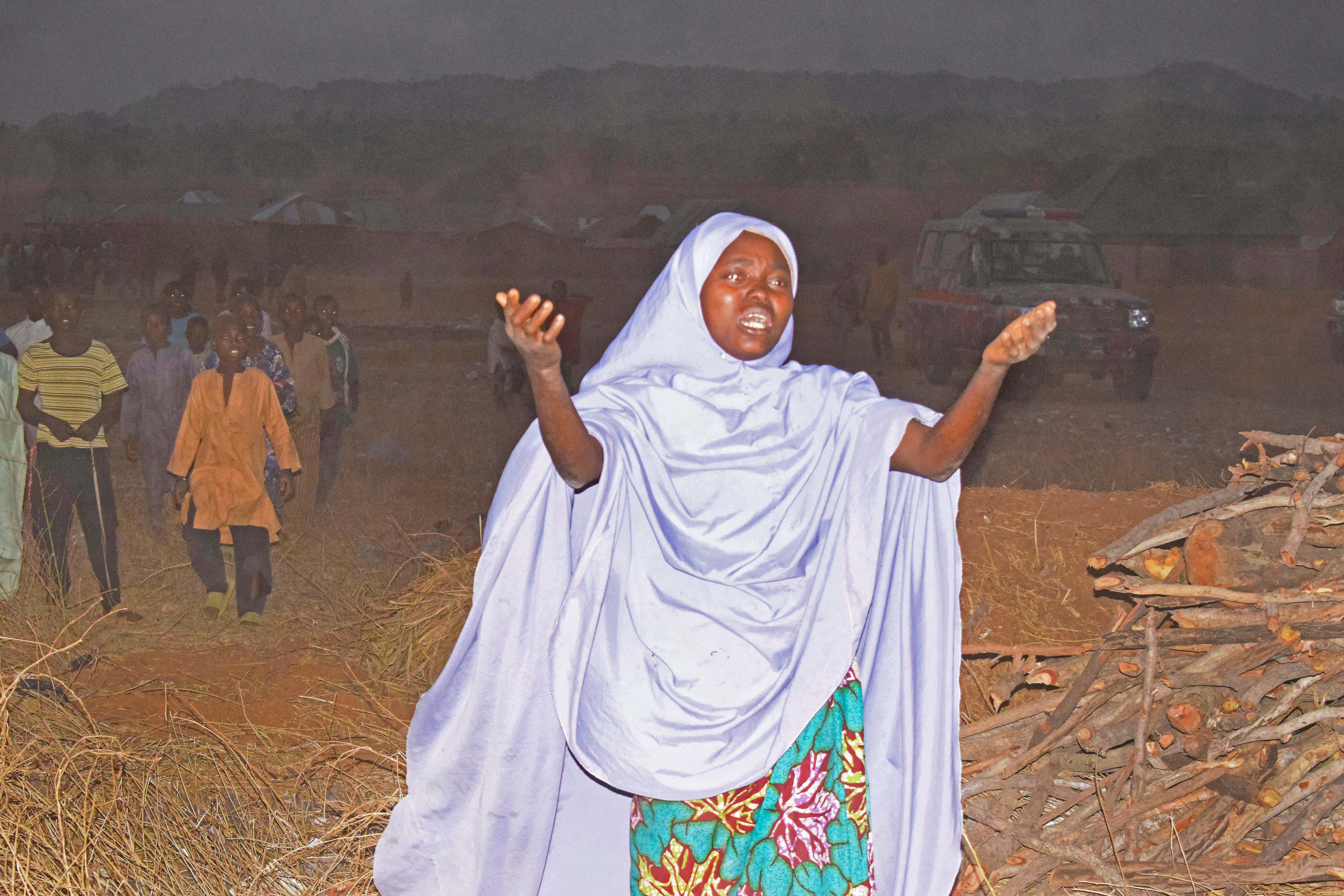 A woman cries as she calls upon the government to help and rescue school children that were kidnapped by gunmen in Chikun, Nigeria, Thursday, 7 March 2024