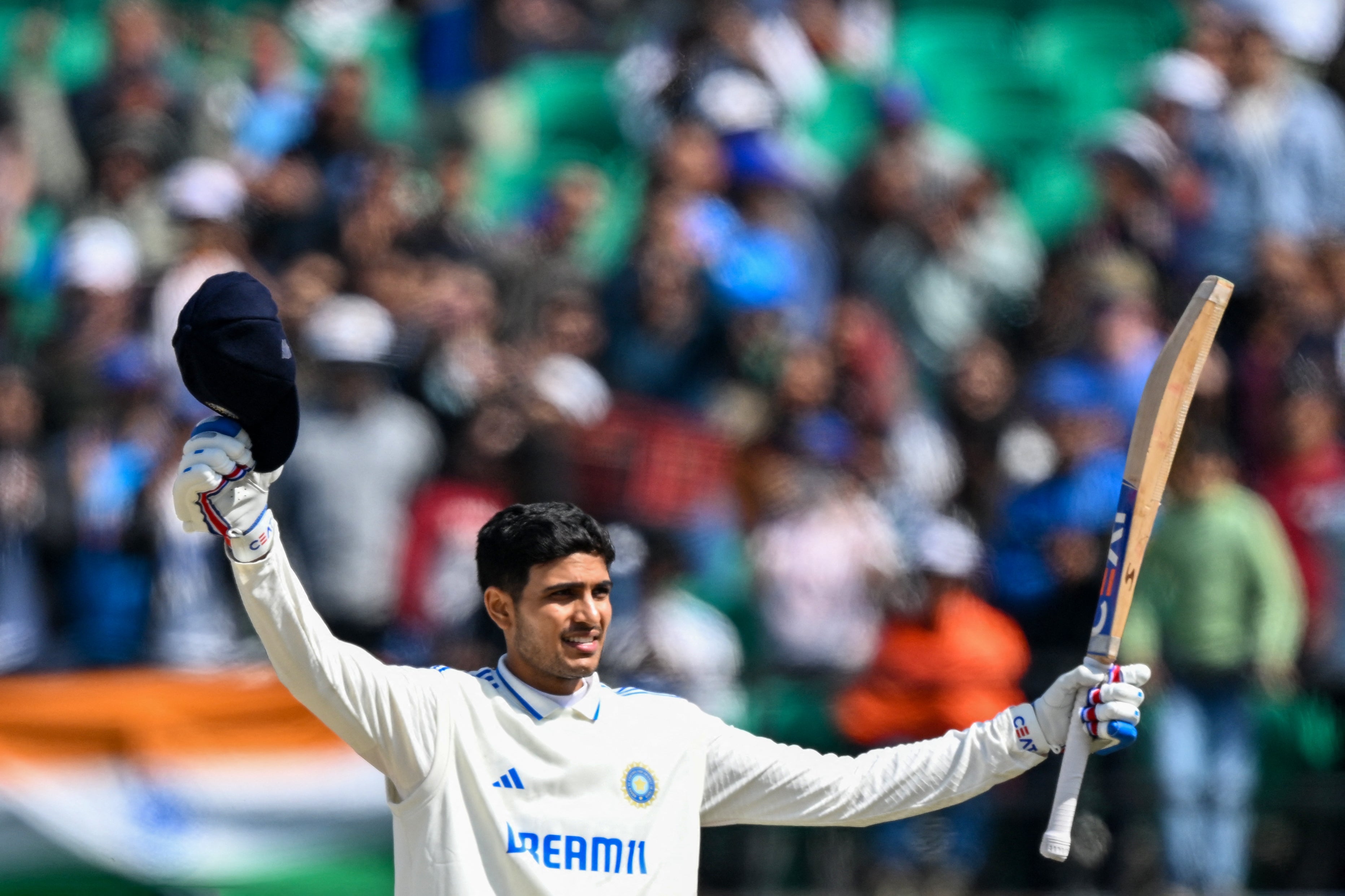 Shubman Gill celebrates after scoring his century