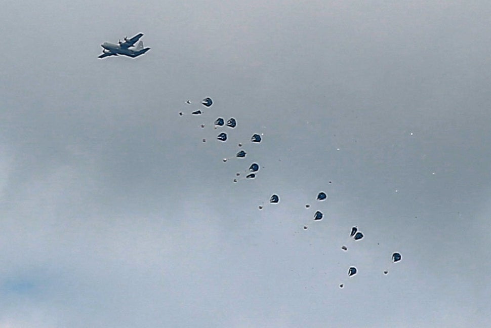 Aid parcels are airdropped over the northern Gaza Strip on March 8, 2024