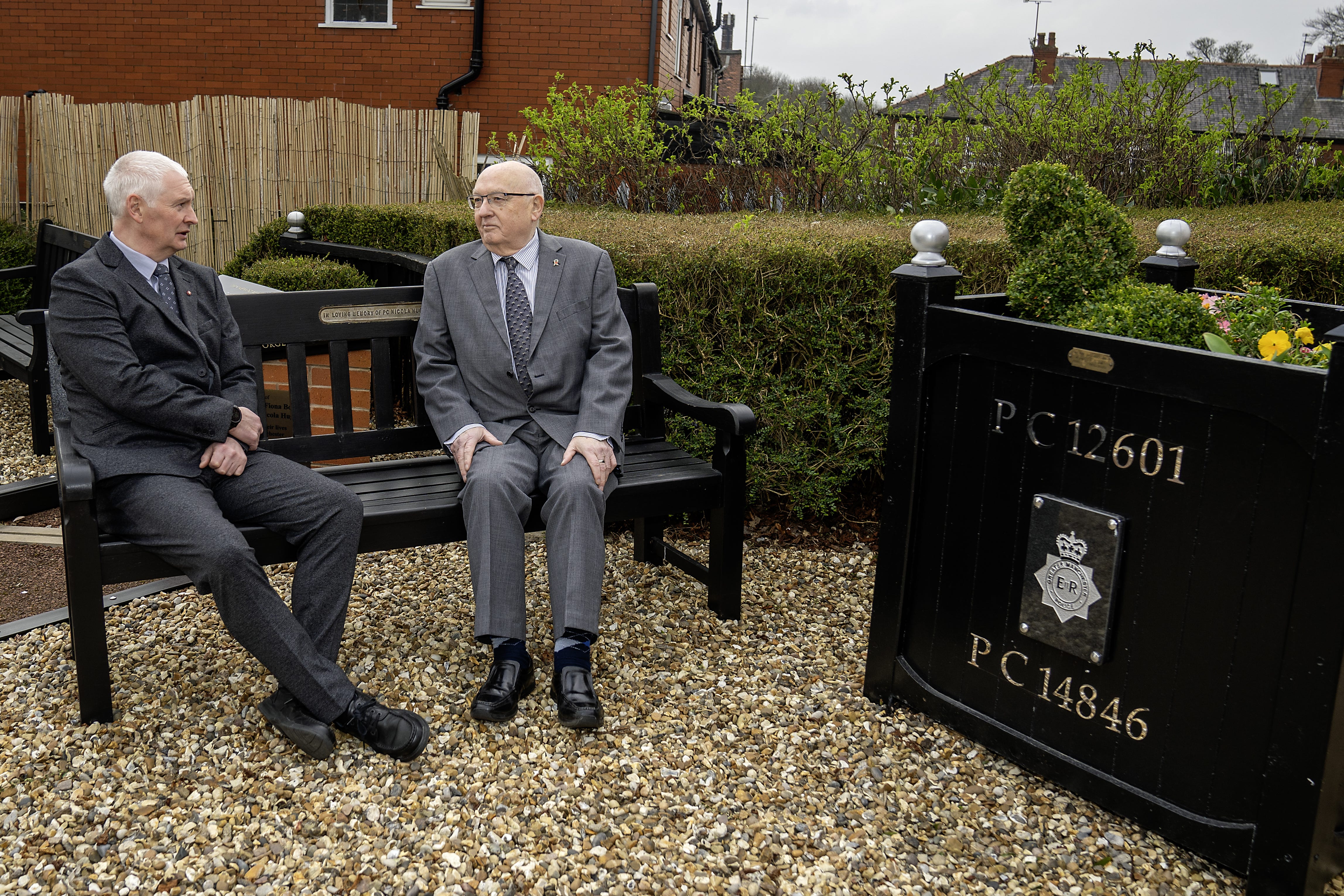 Bryn Hughes (left) and Paul Bone, the fathers of murdered Pcs Nicola Hughes and Fiona Bone, at the Hyde police station memorial garden in Manchester (Peter Byrne/PA)