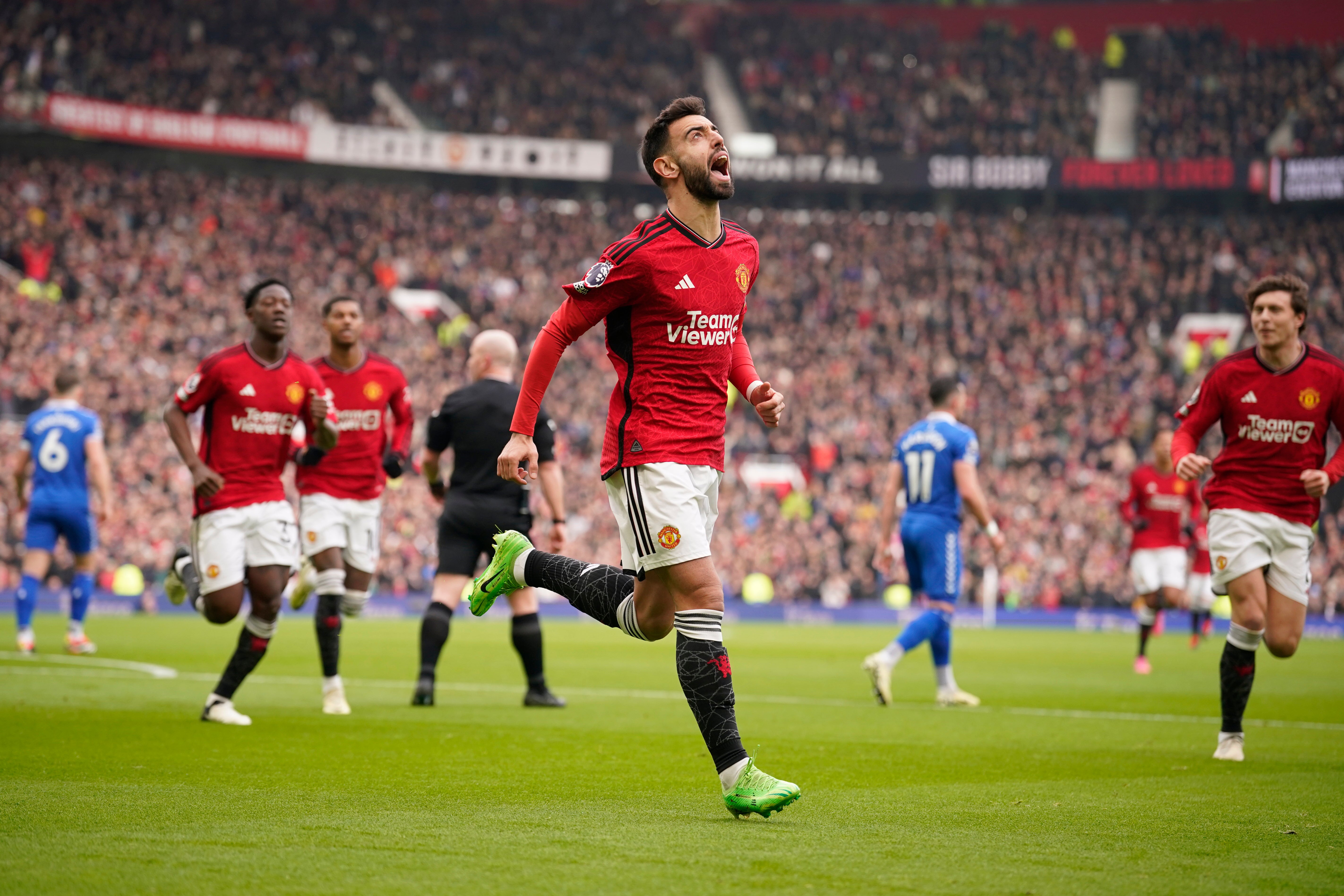 Fernandes celebrates after converting the spot-kick