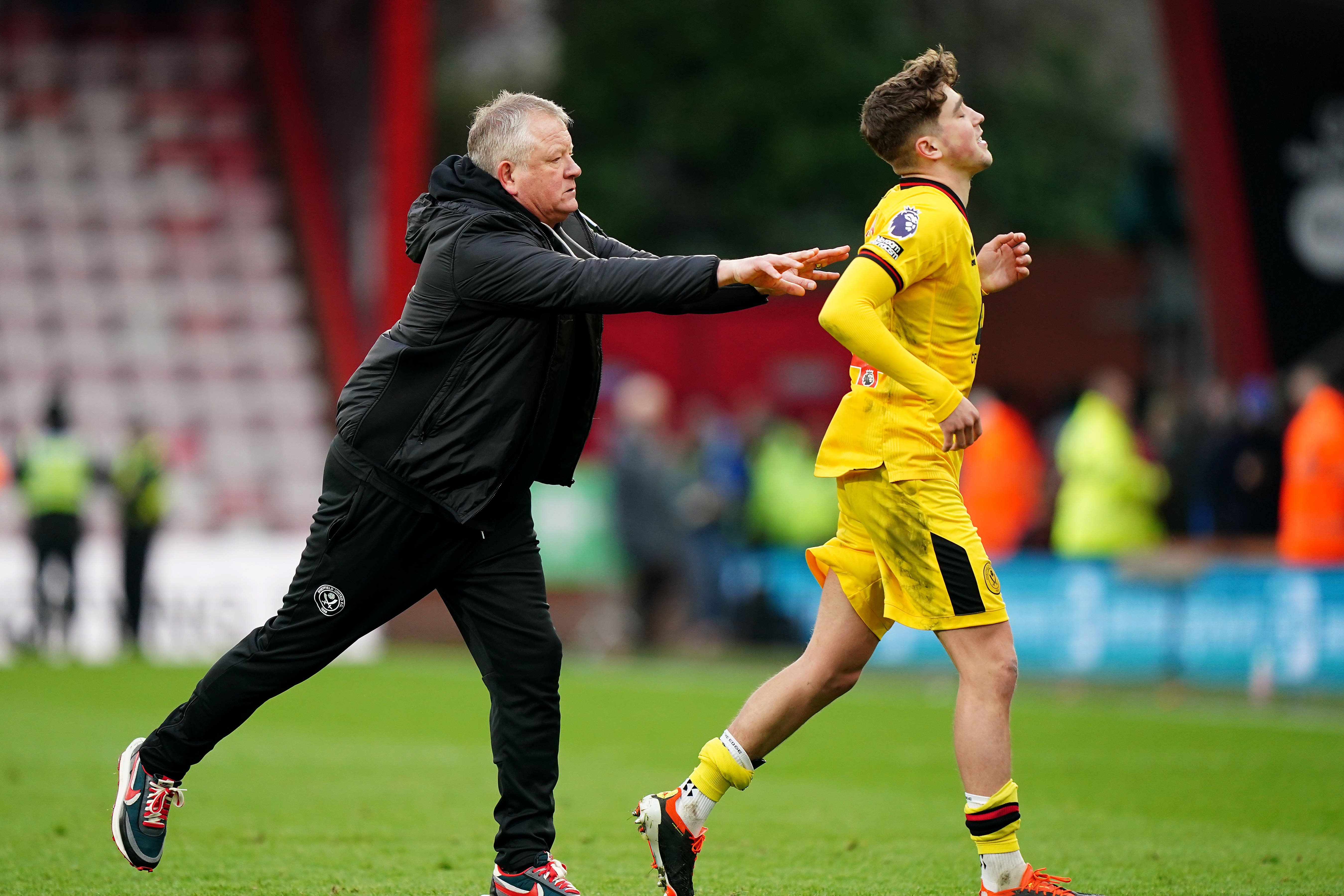 Sheffield United manager Chris Wilder pushes Oliver Arblaster towards the fans after the Premier League match at the Vitality Stadium, Bournemouth. Picture date: Saturday March 9, 2024.