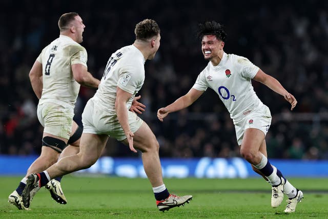 <p>Marcus Smith, right, celebrates his match-winning kick </p>