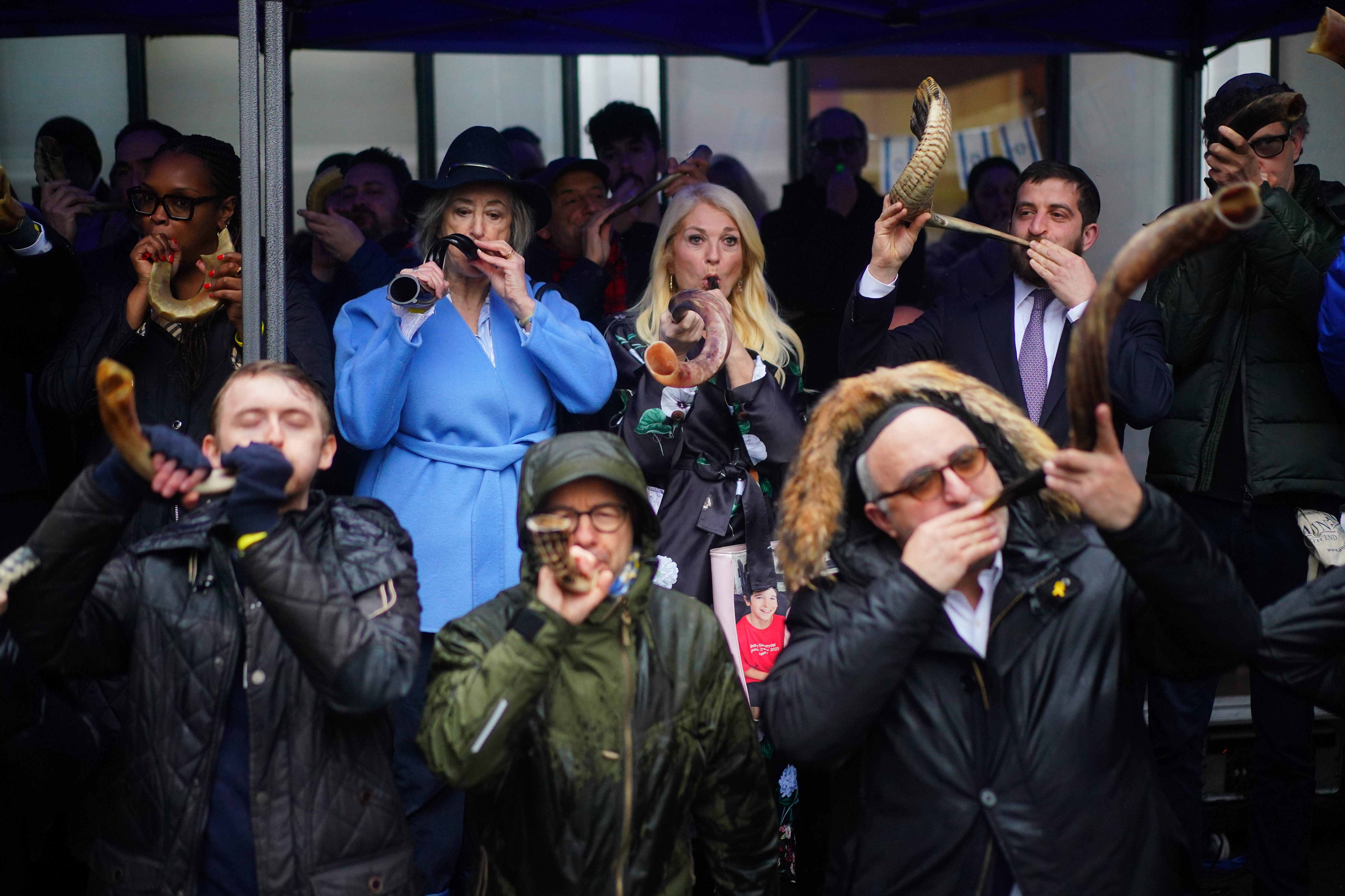 People blowing shofars and whistles led by Vanessa Feltz and Dame Maureen Lipman (Victoria Jones/PA)