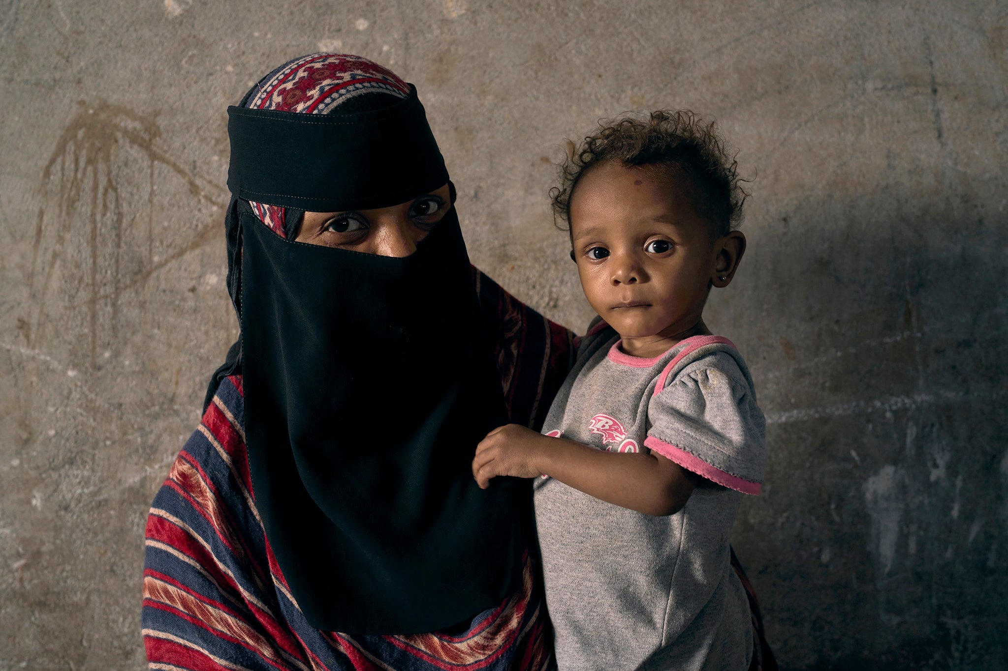 Mohalla with her daughter Maymoona Bassam (14 months) who weighs just 5kgs