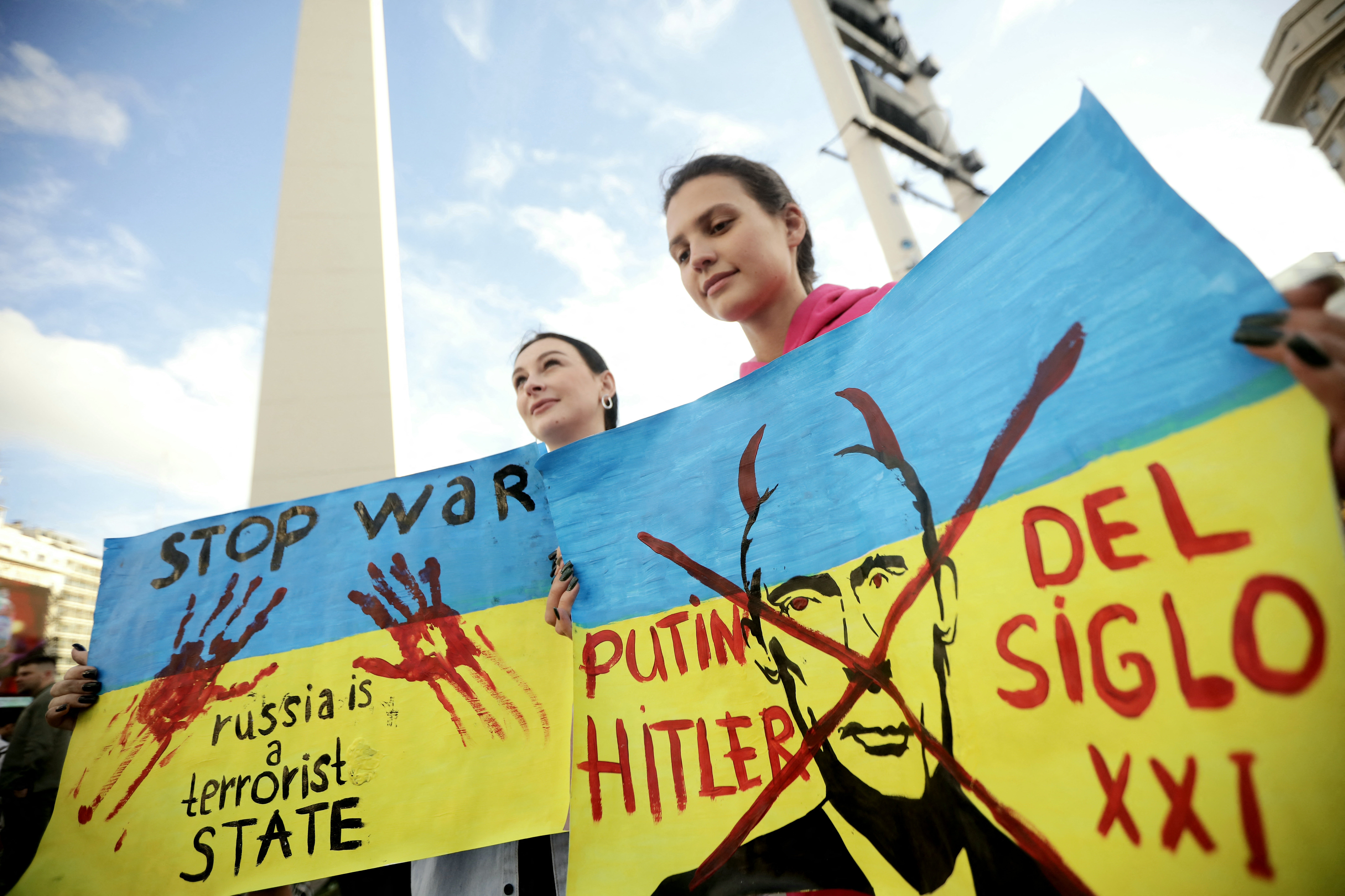 Pro-Ukraine demonstrators take part in a rally commemorating the second anniversary of the Russian invasion of Ukraine at the Obelisk in Buenos Aires