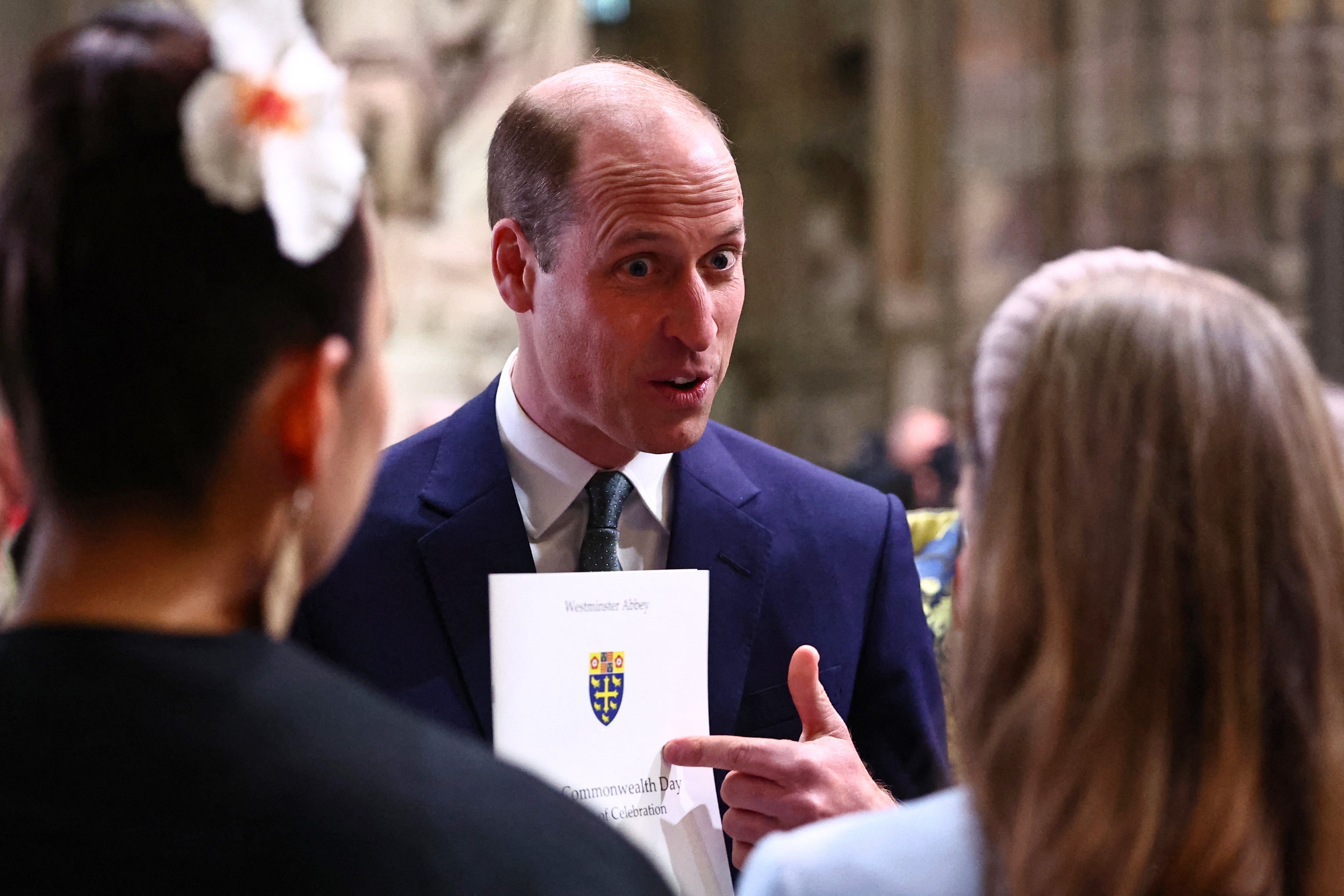 The Prince of Wales speaks with guests as he attends an annual Commonwealth Day service ceremony at Westminster Abbey in London on Monday