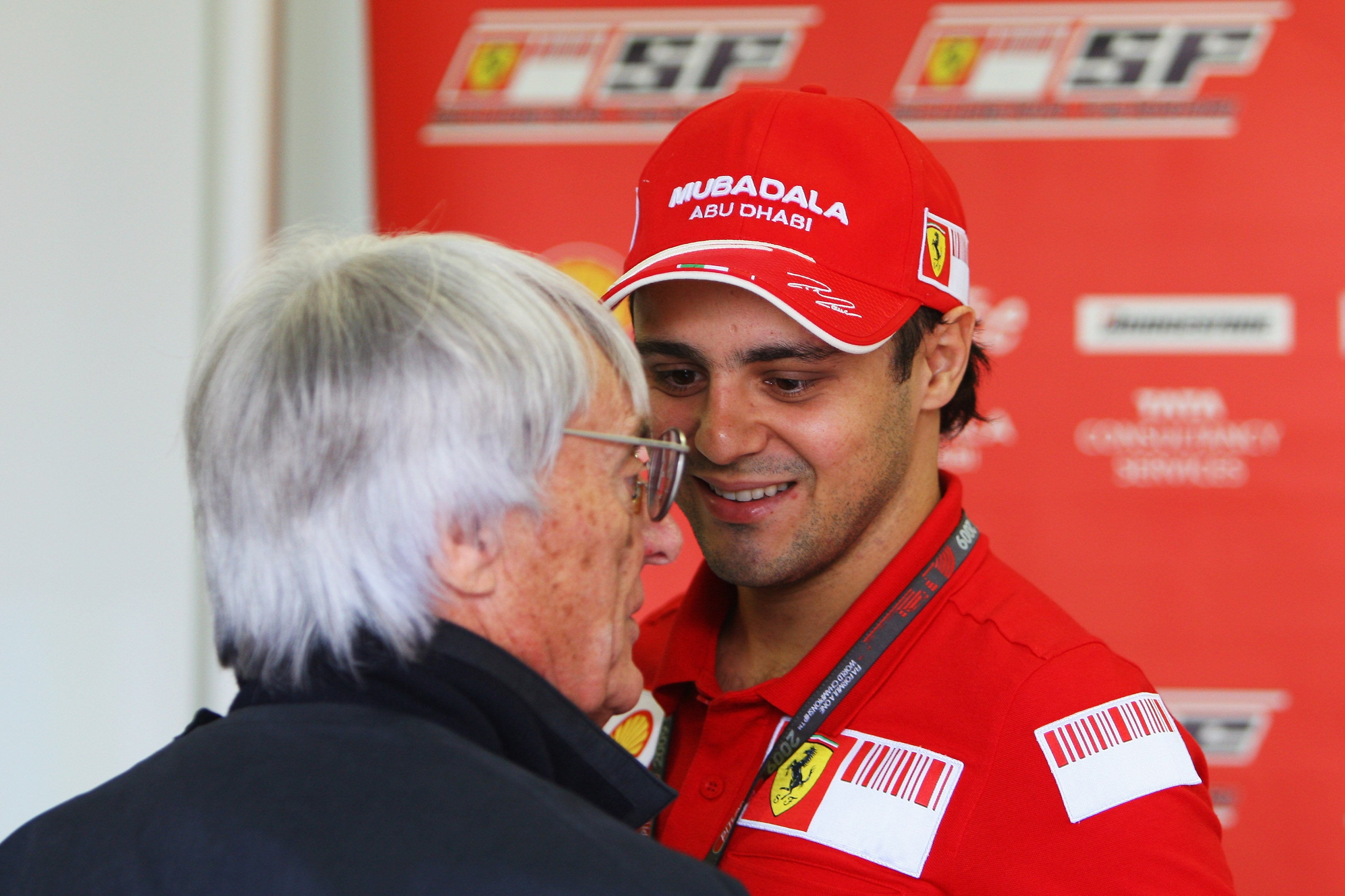 Felipe Massa (right) is suing F1, the FIA and ex-F1 supremo Bernie Ecclestone (left)