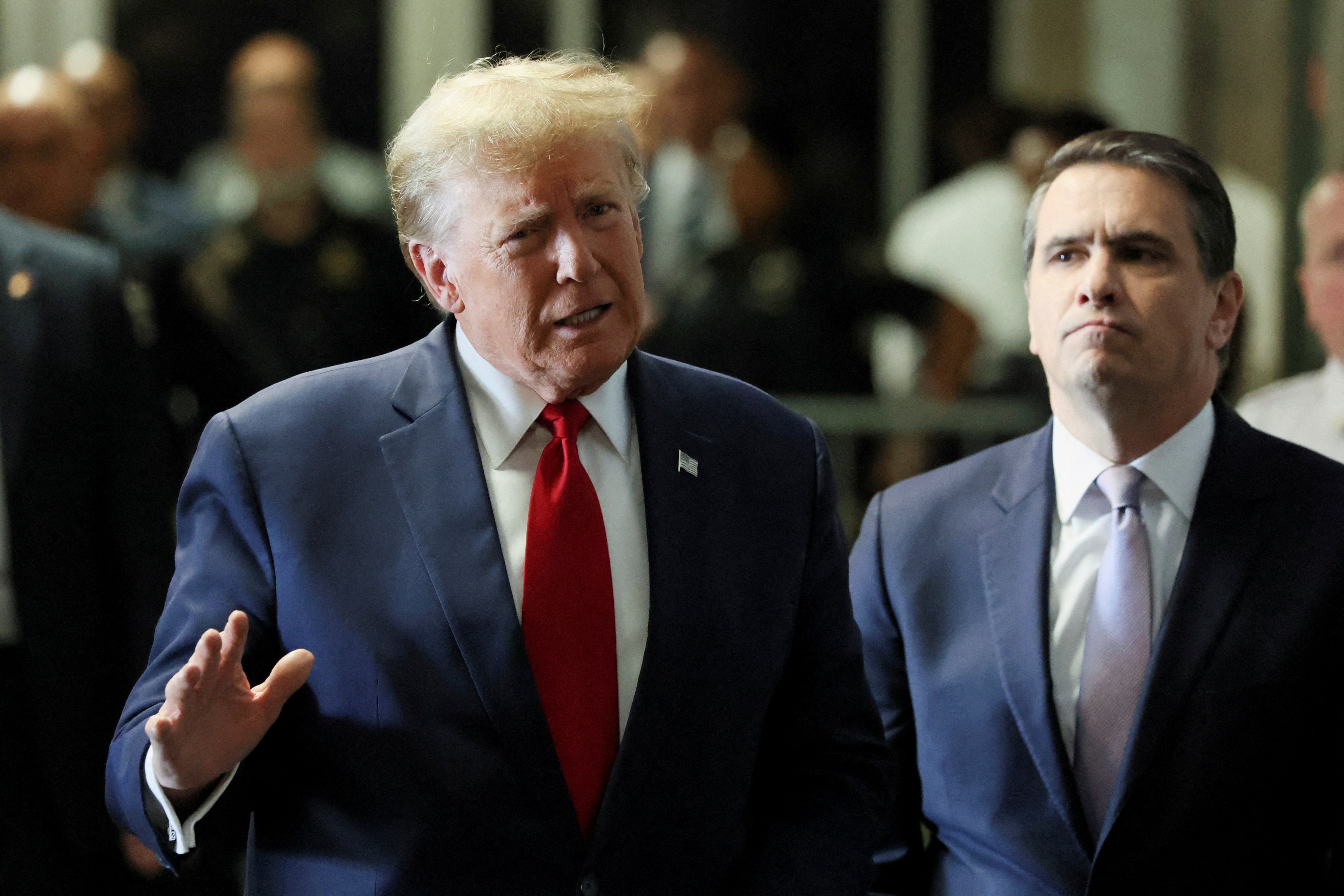 Donald Trump speaks to reporters outside a pretrial hearing in New York City on 15 February