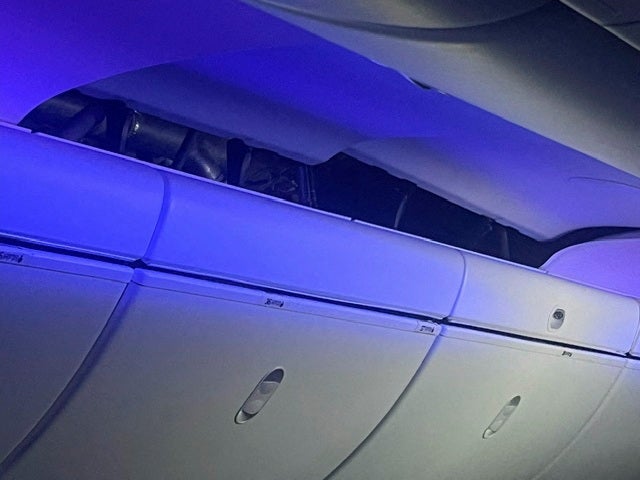 A view of the damage sustained to the ceiling of the airplane