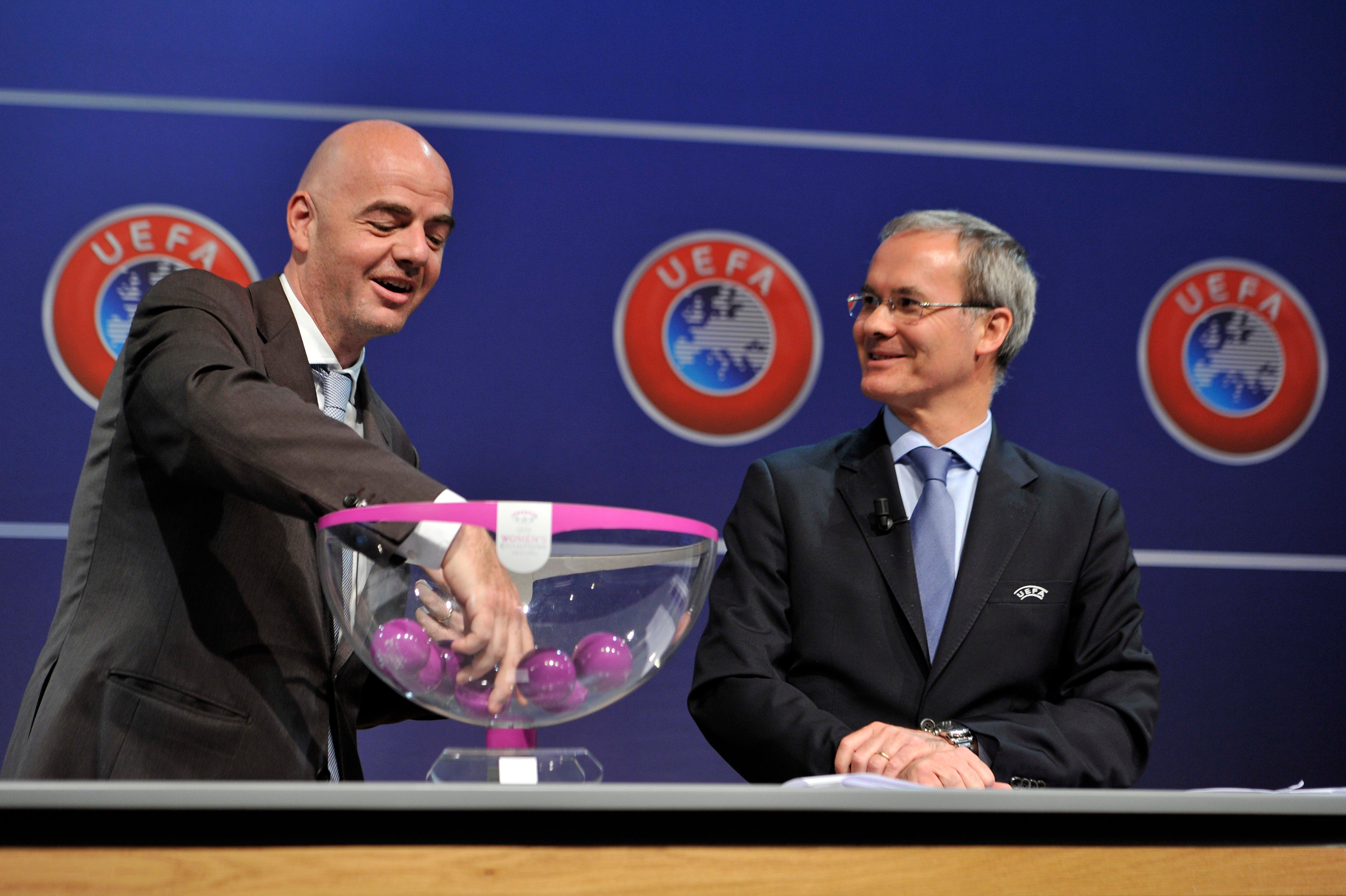 Gianni Infantino and Giorgio Marchetti in draw action at Uefa’s headquarters