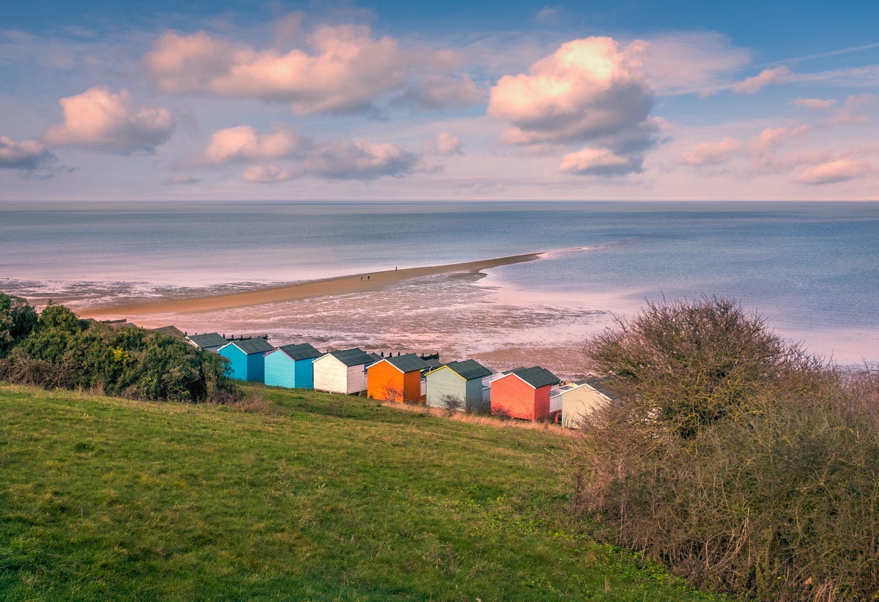 A rainbow of beach huts fringe Tankerton Beach