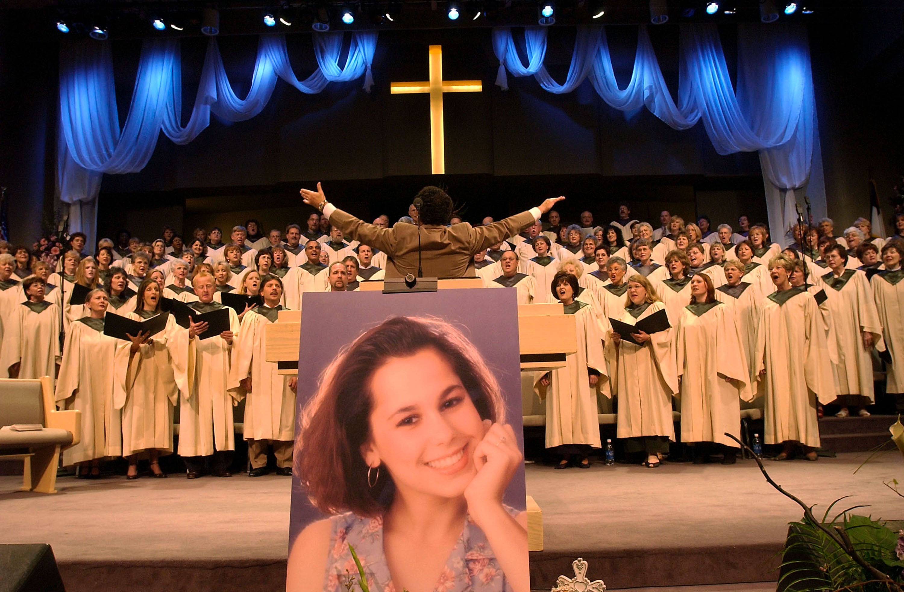 A choir sings during the memorial service for Laci Peterson and her unborn son Conner May 4, 2003 in Modesto, California.