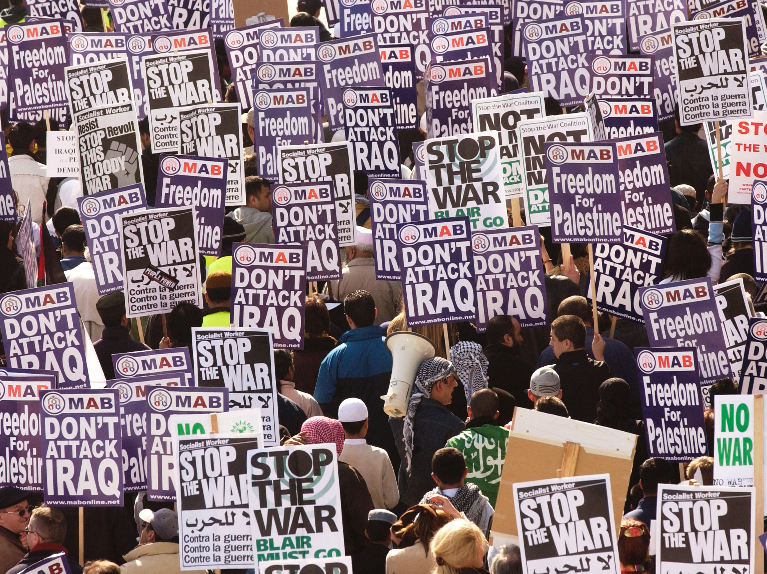 Demonstrators march towards parliament in protest of the UK’s involvement in the Iraq War