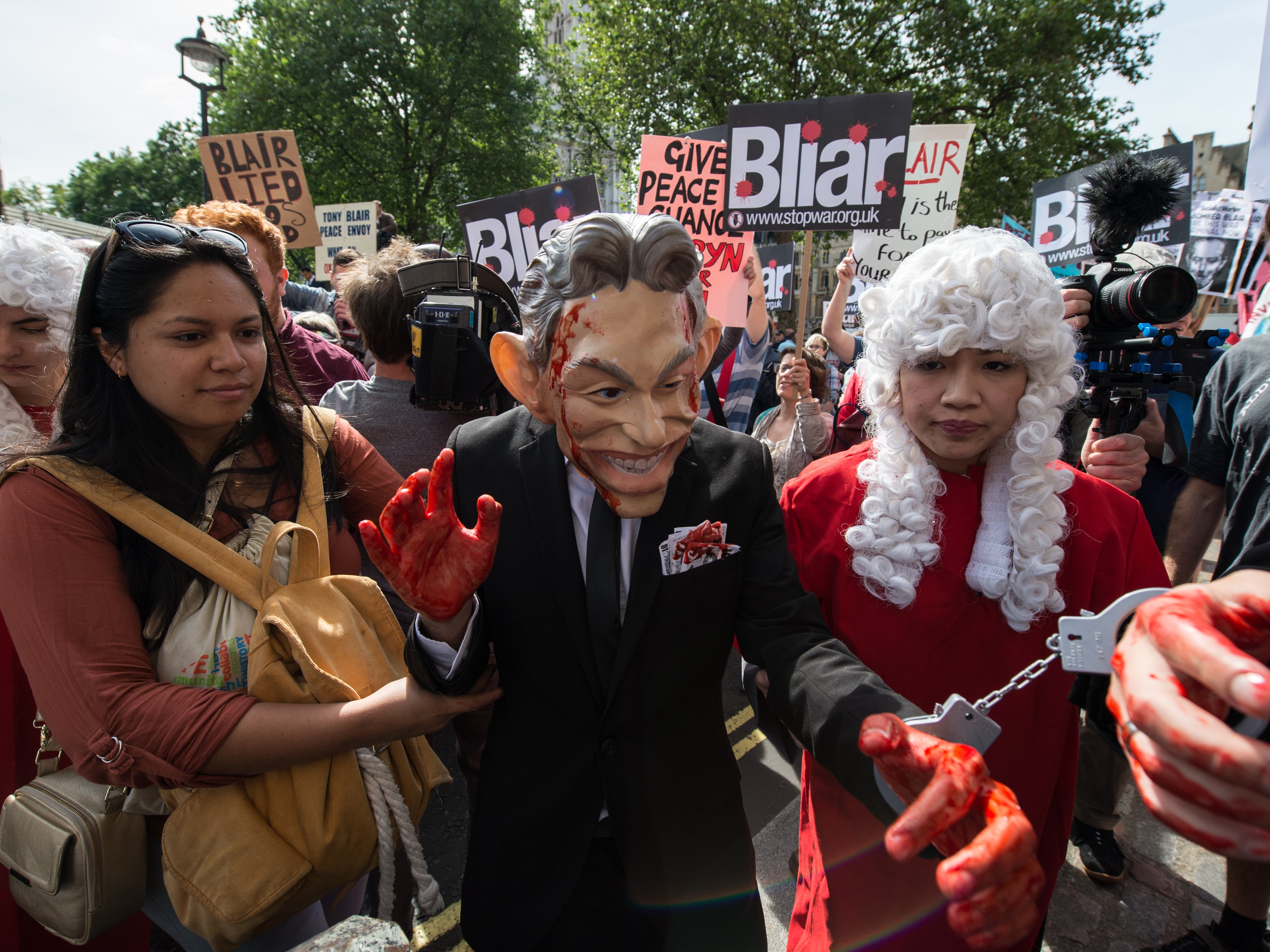 Anti-war protesters gather outside the Queen Elizabeth II Conference Centre after the publication of the Chilcot inquiry in 2016