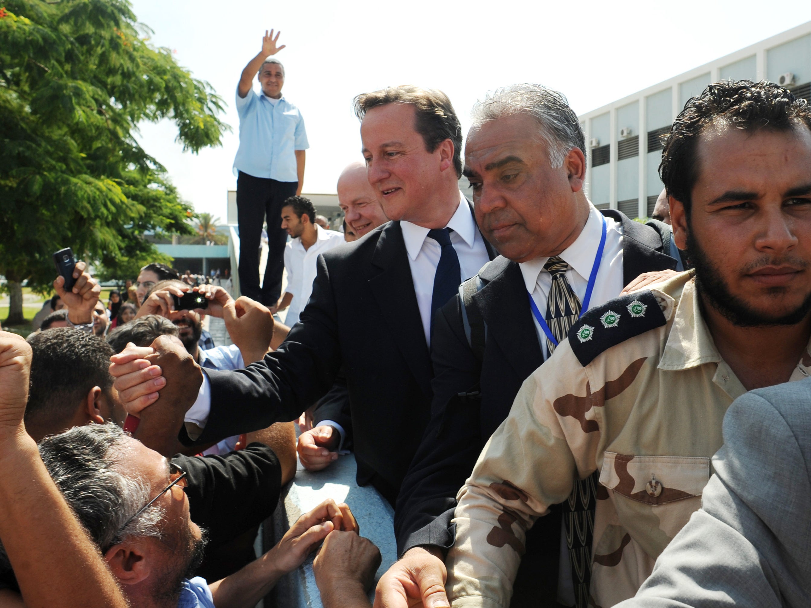 Cameron and William Hague during a visit to the Tripoli Medical Centre as part of their trip following the country's revolution in 2011