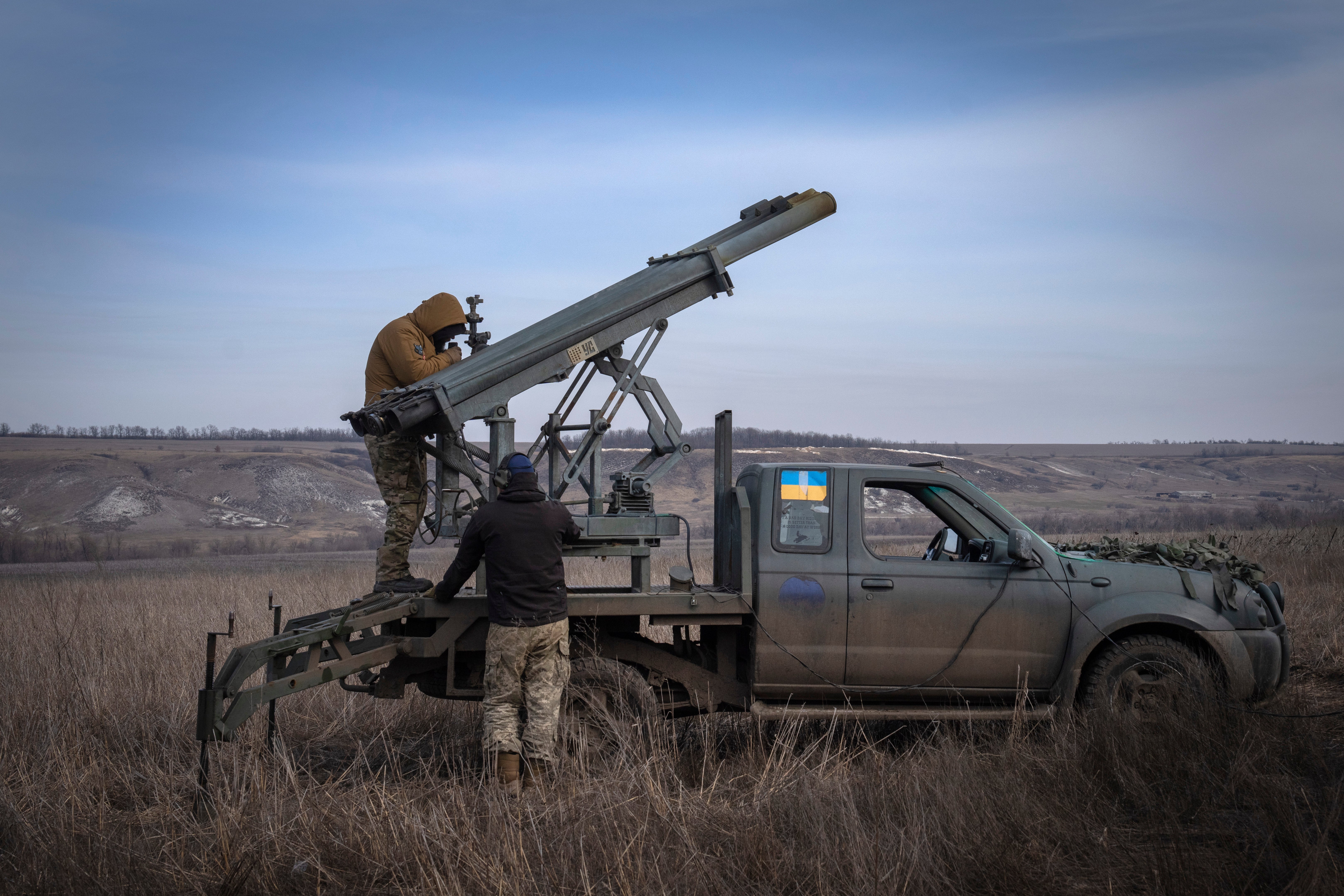 Ukrainian soldiers from The 56th Separate Motorized Infantry Mariupol Brigade prepare to fire a multiple launch rocket system based on a pickup truck towards Russian positions at the front line, near Bakhmut