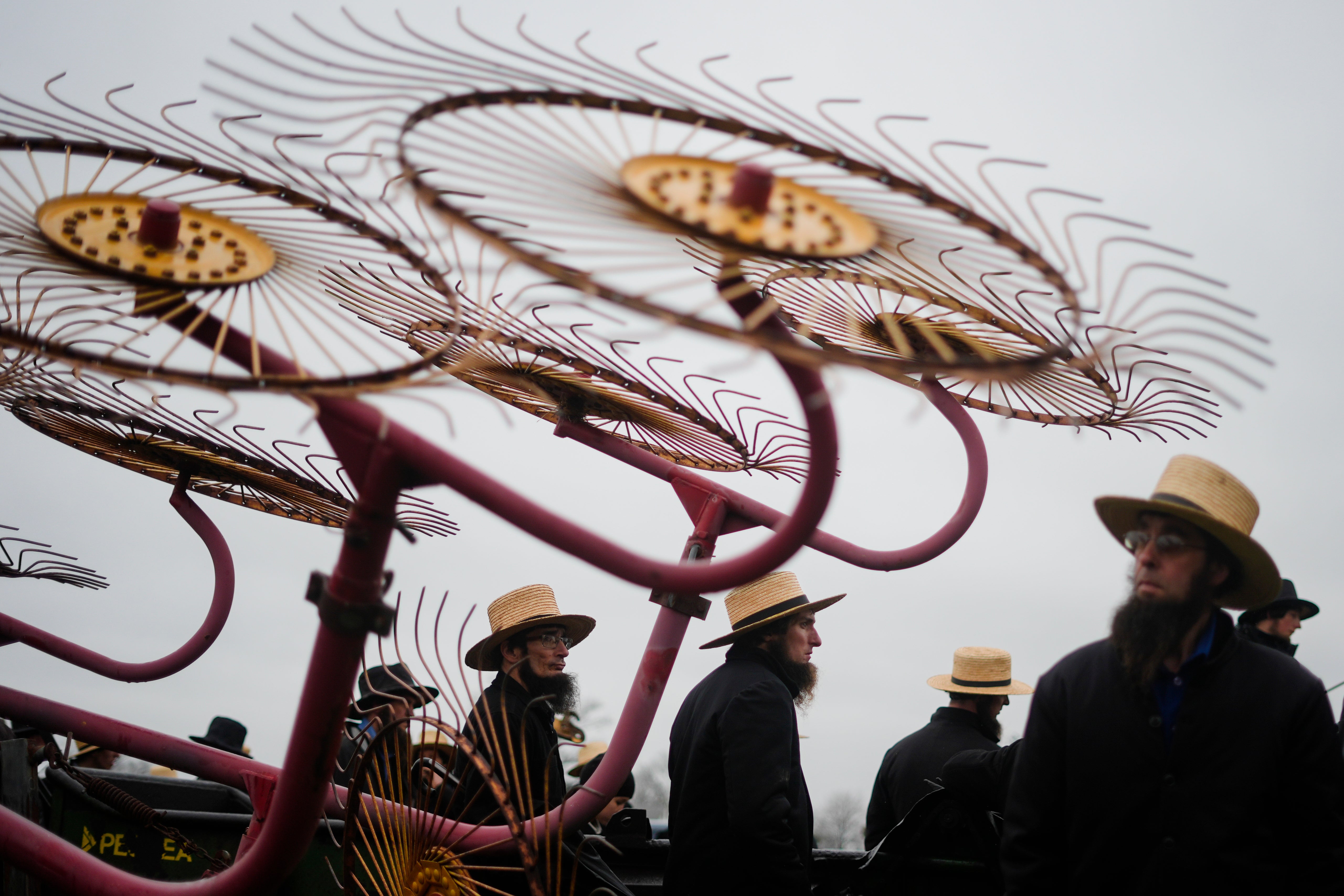 People gather for an auction of farm equipment during 56th annual mud sale to benefit the local fire department in Gordonville, Pa., Saturday, March 9, 2024. Mud sales are a relatively new tradition in the heart of Pennsylvania's Amish country, going back about 60 years.