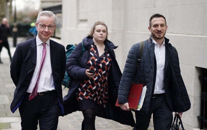 Michael Gove with officials