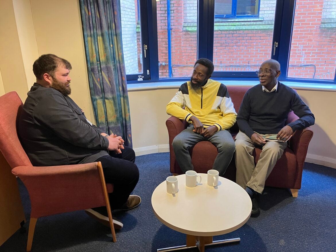 Salvation Army staff member Louis Juster (left) with residents at St Ann’s shelter in central London