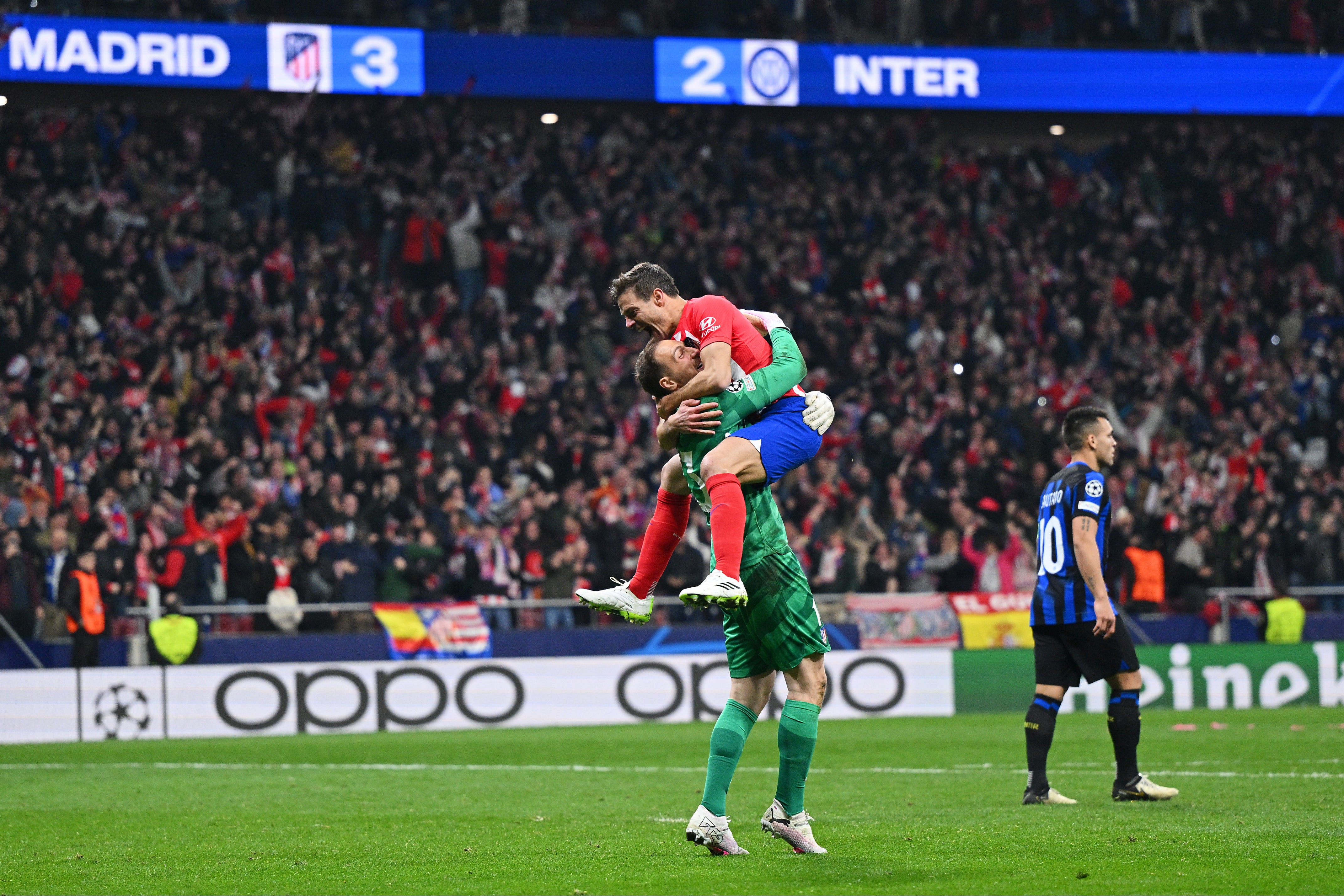 Jan Oblak and Cesar Azpilicueta celebrate Atletico’s shootout win