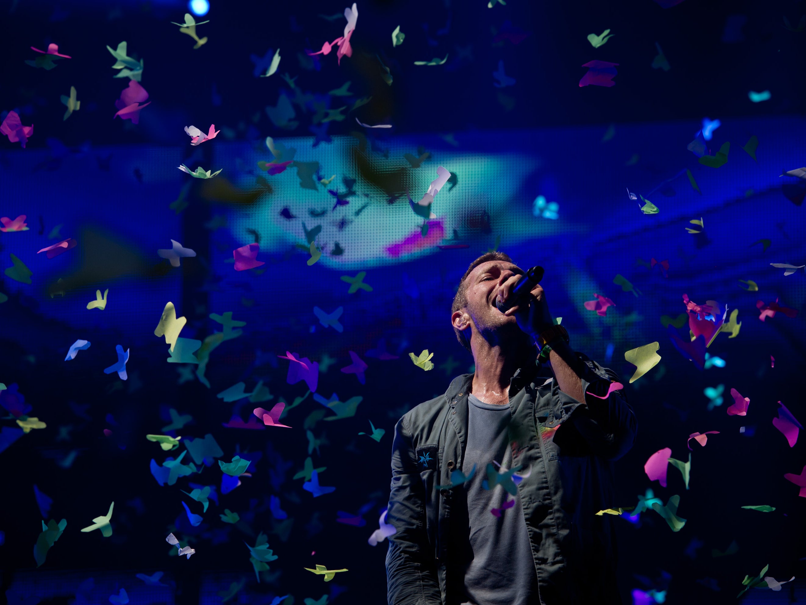 Chris Martin of Coldplay performs live on the pyramid stage during the Glastonbury Festival in 2011