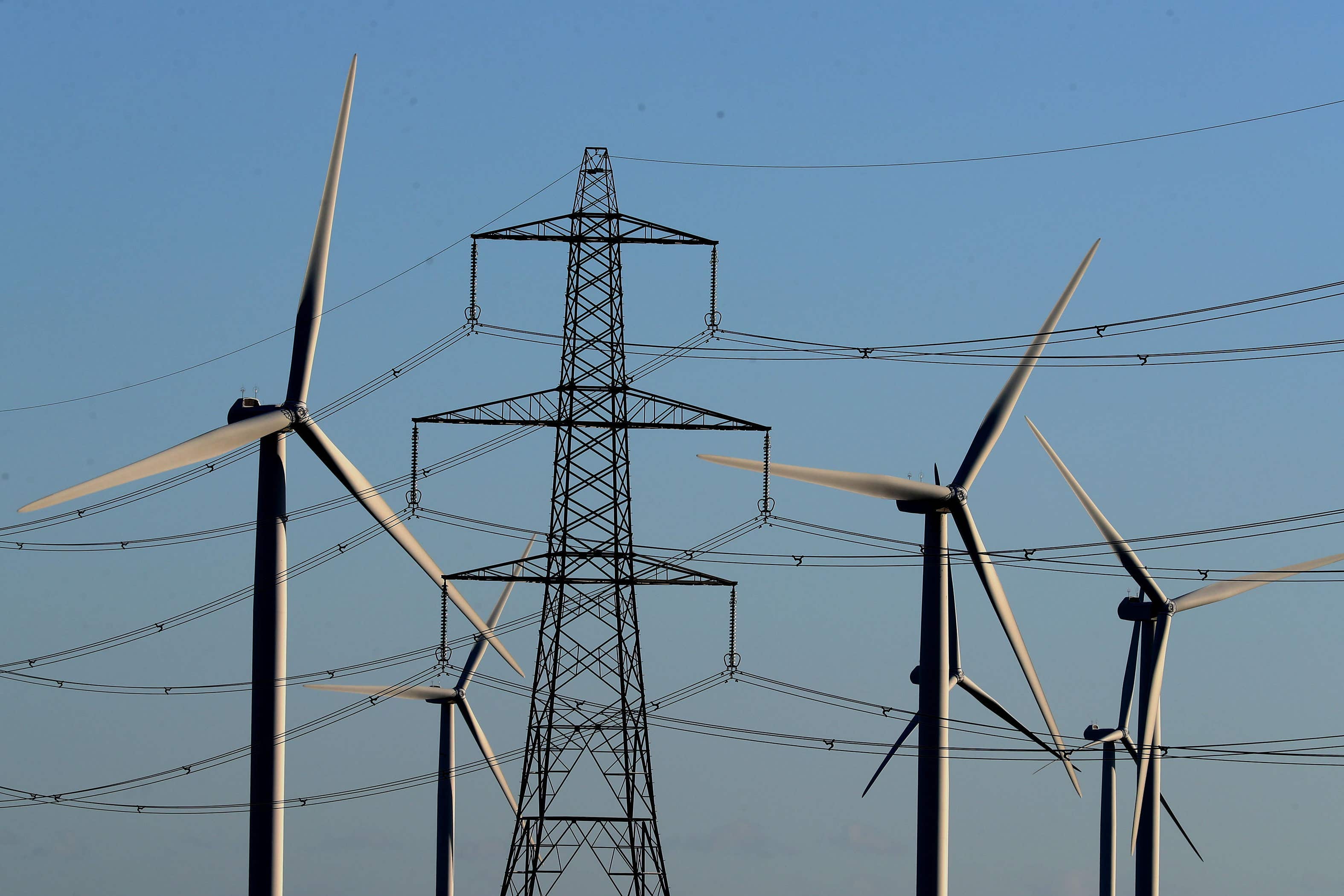 Little Cheyne Court Wind Farm amongst existing electricity pylons on the Romney Marsh in Kent (Gareth Fuller/PA)