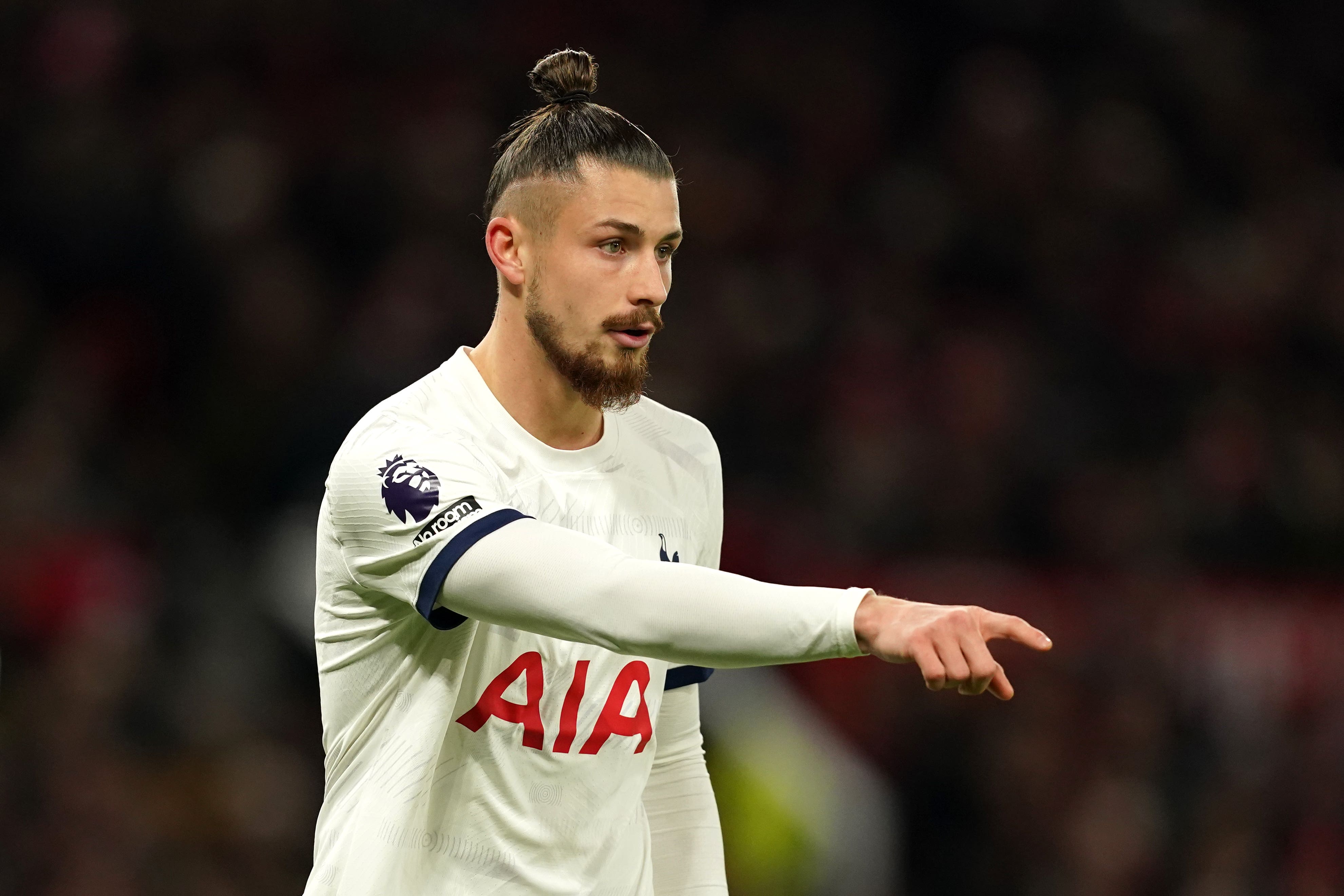 Radu Dragusin will make his first Tottenham start at Fulham (Martin Rickett/PA)