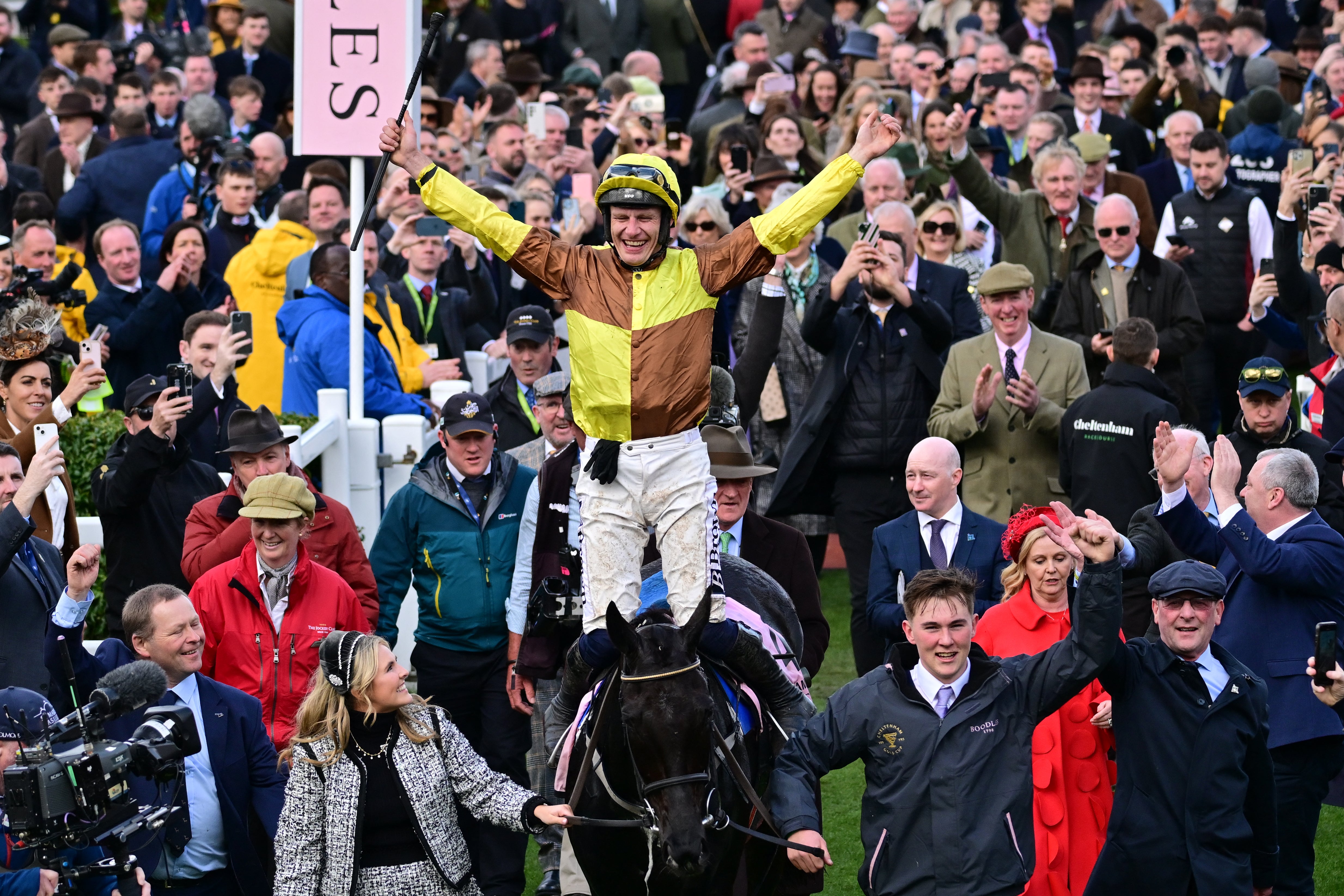 Jockey Paul Townend celebrates as he arrives in the winner's enclosure after riding Galopin Des Champs to victory in the Cheltenham Gold Cup