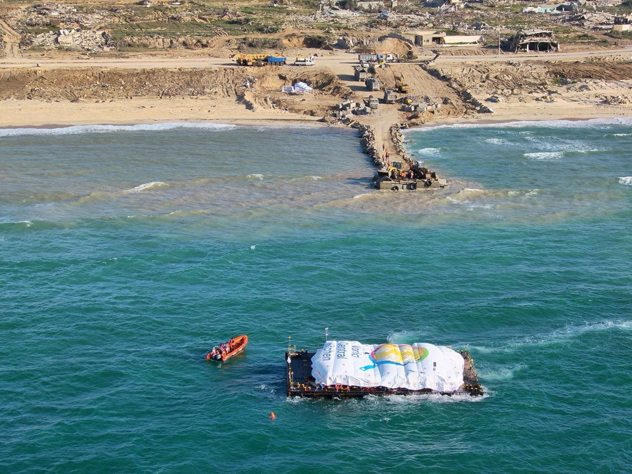 Aerial view shows a World Central Kitchen (WCK) barge loaded with food arriving off Gaza