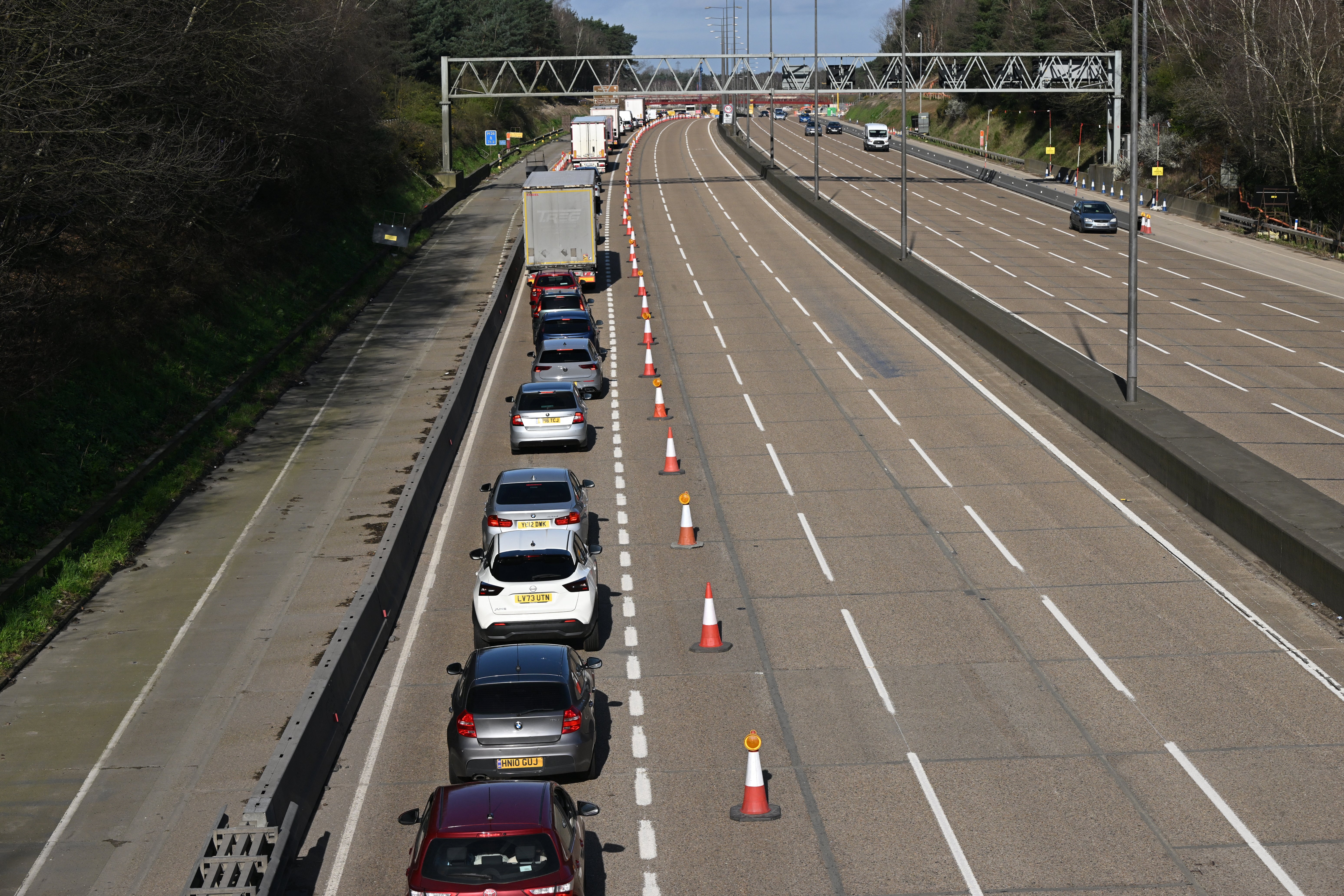 Vehicles are seen queueing to leave the carriageway at Junction 10 of the London orbital motorway