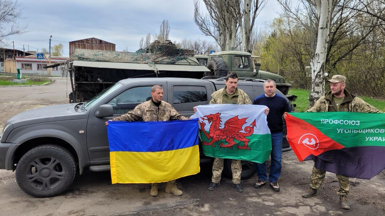 Soldiers from a miners union with a vehicle donated in the Welsh convoy – near the frontline in southeastern Ukraine