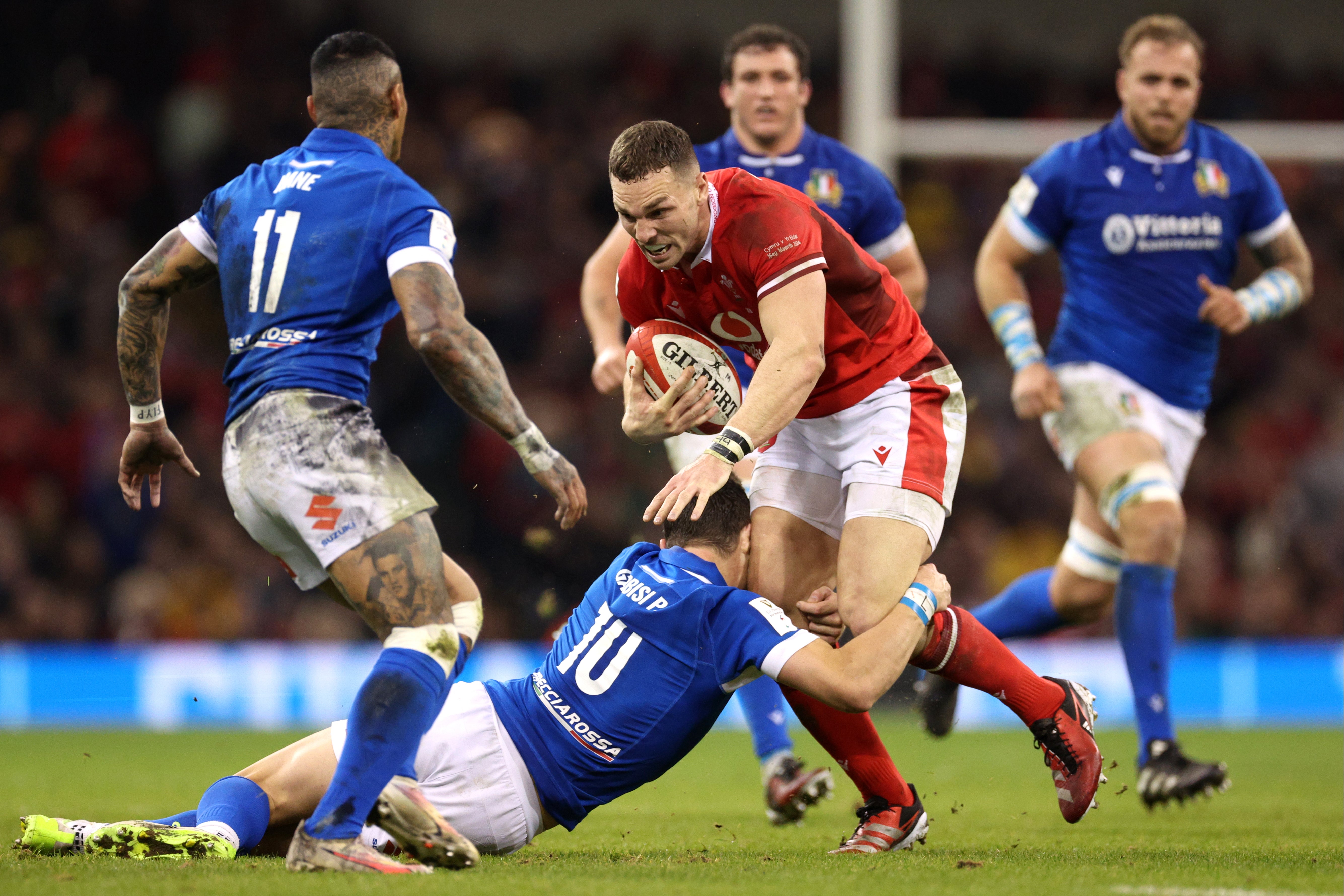 George North, in his last game for Wales, is tackled by Paolo Garbisi