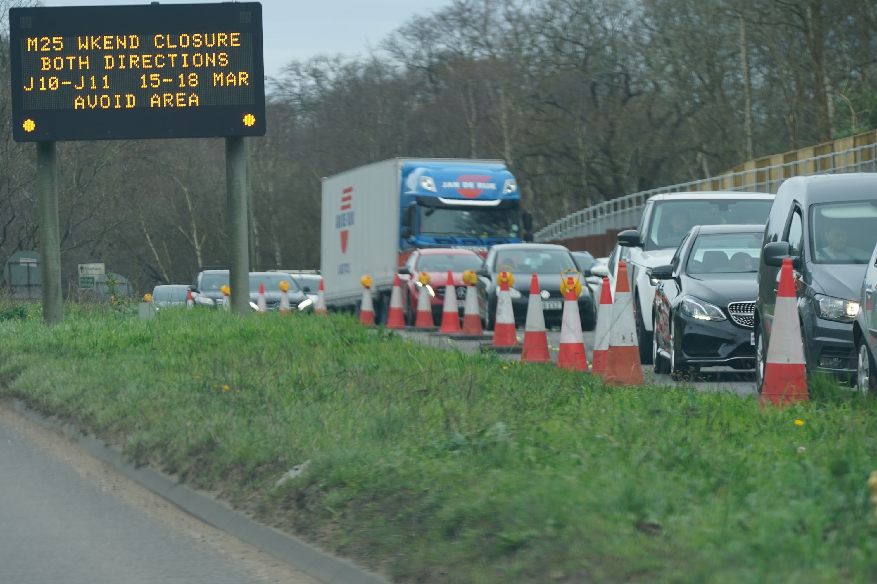 An information sign as traffic builds up in Cobham, Surrey, near to a closed section of the M25