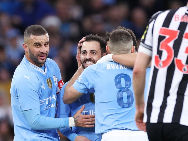 <p>Bernardo Silva, centre, celebrates scoring his second goal </p>