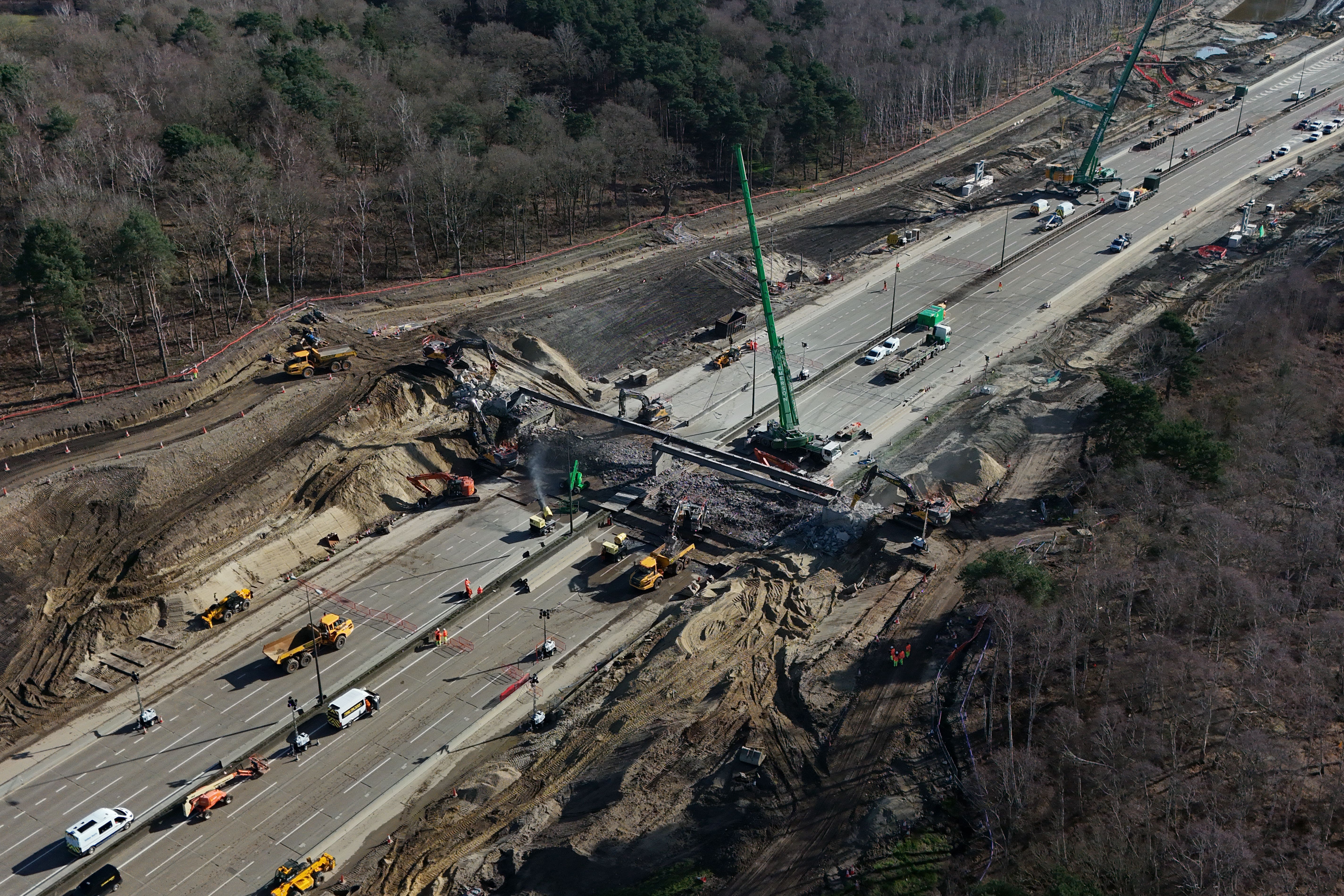 A bridge is being demolished and a new gantry installed (Yui Mok/PA)