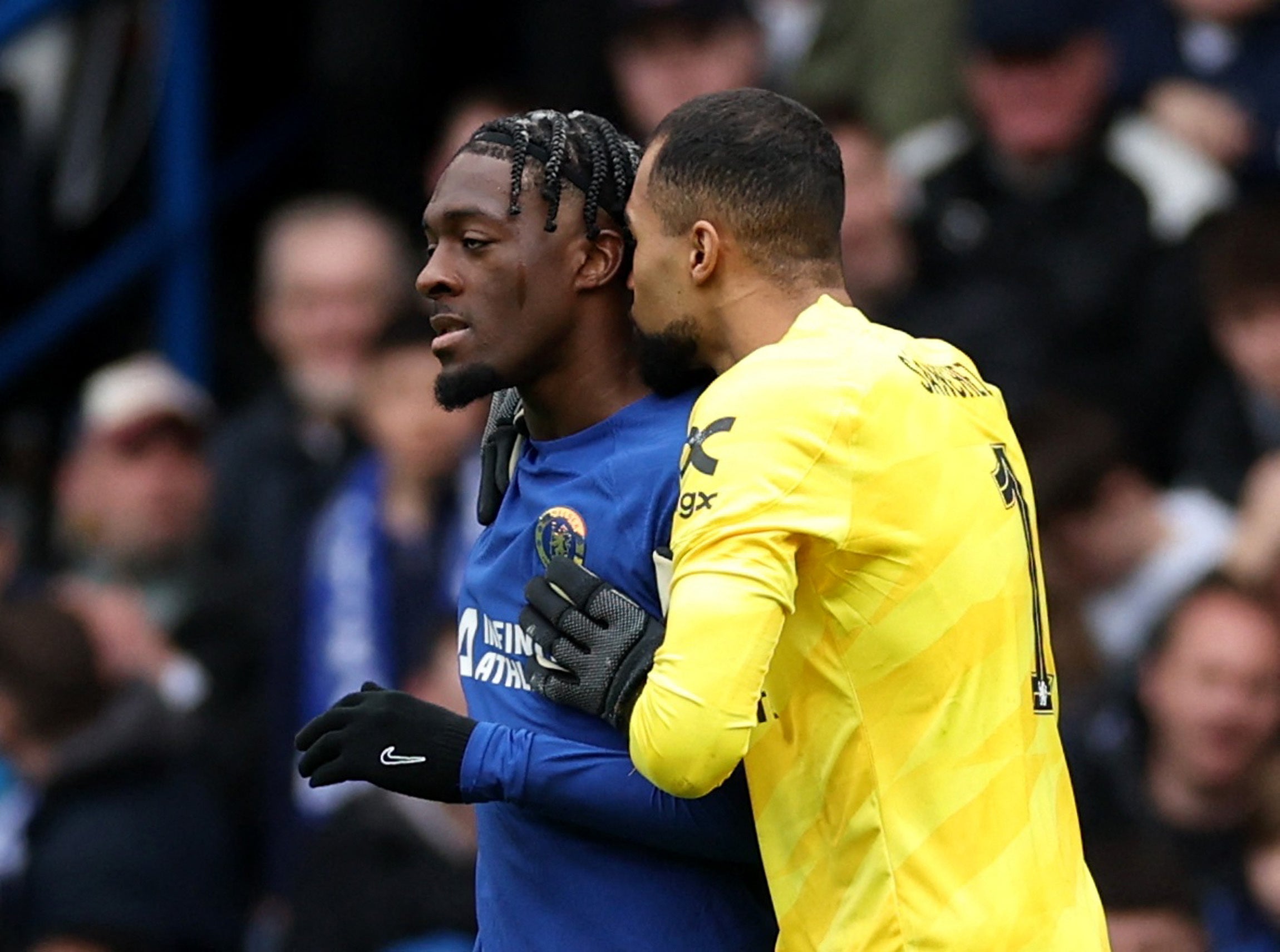 Axel Disasi is consoled by Robert Sanchez after his own goal