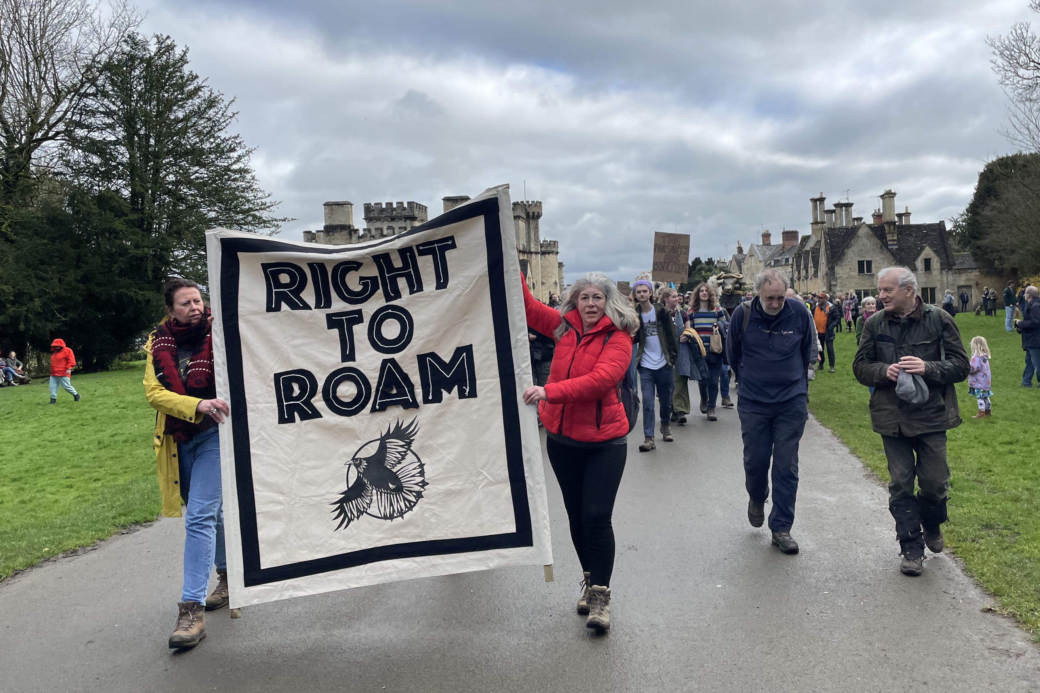 People taking part in a mass trespass in protest against new charges to access Cirencester Park (Claire Hayhurst/PA)