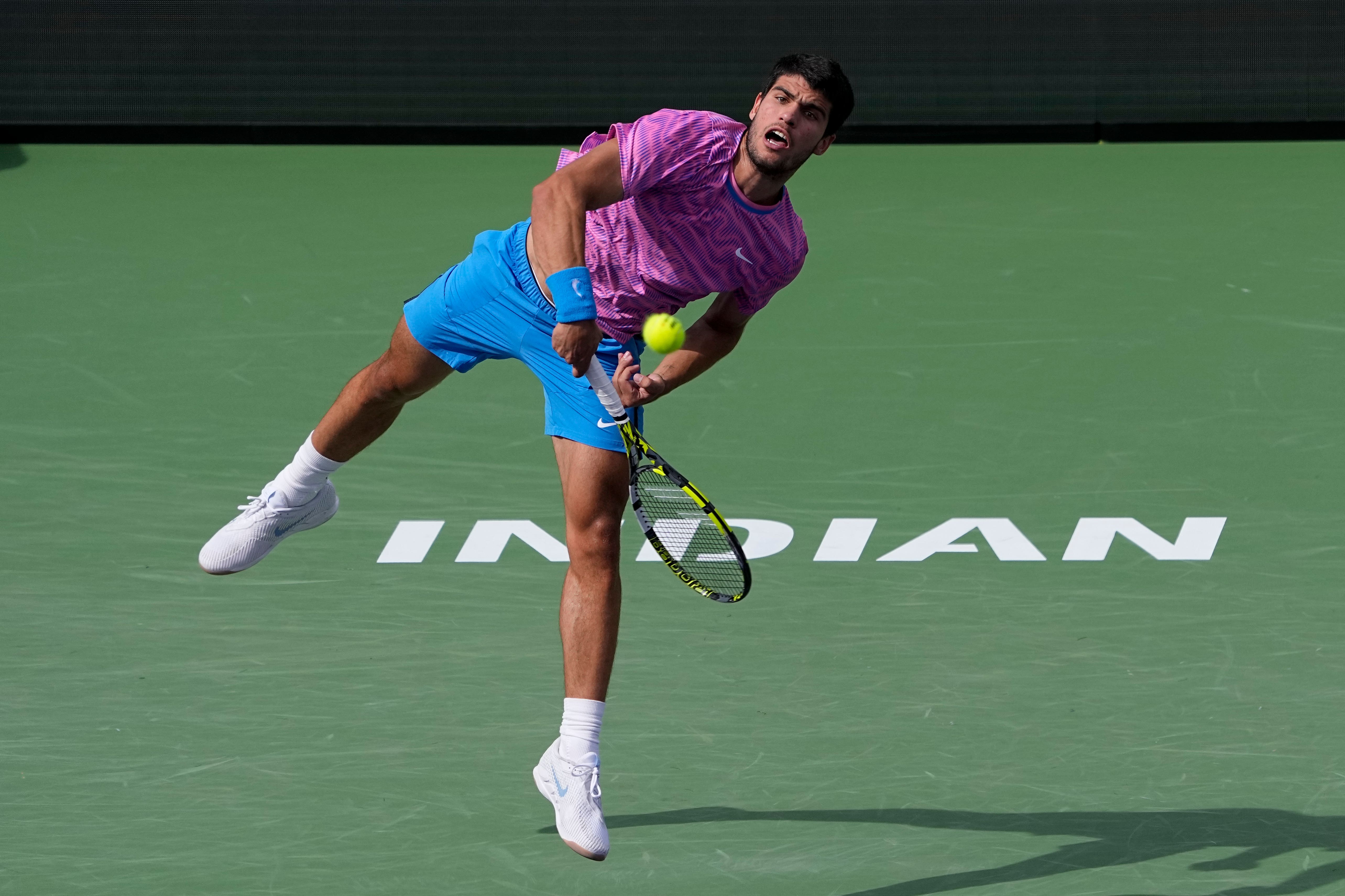 Carlos Alcaraz, of Spain, serves to Daniil Medvedev, of Russia, during the final match at the BNP Paribas Open (Mark J Terrill/AP)