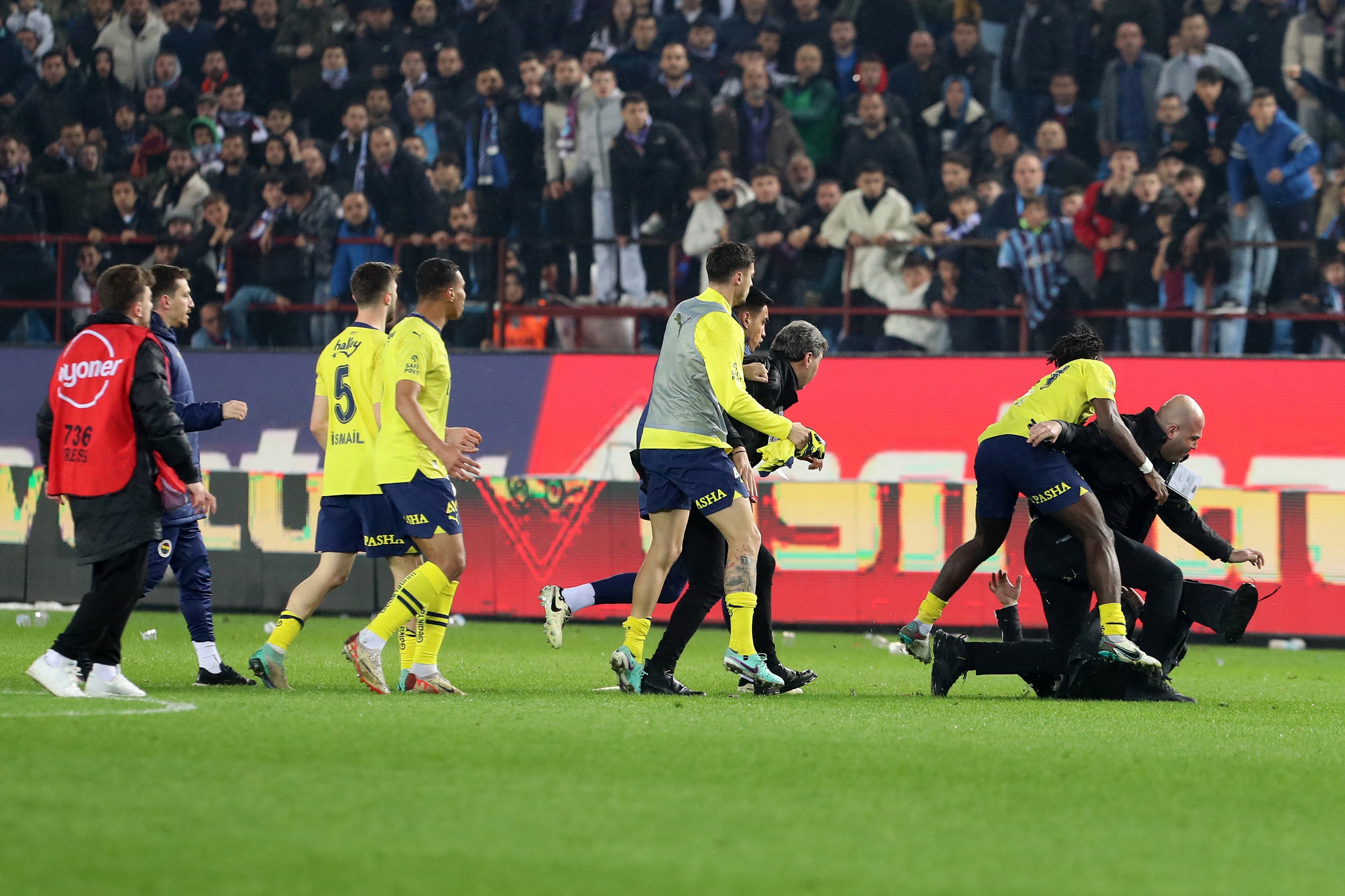 Bright Osayi-Samuel throws a pitch invader to the ground