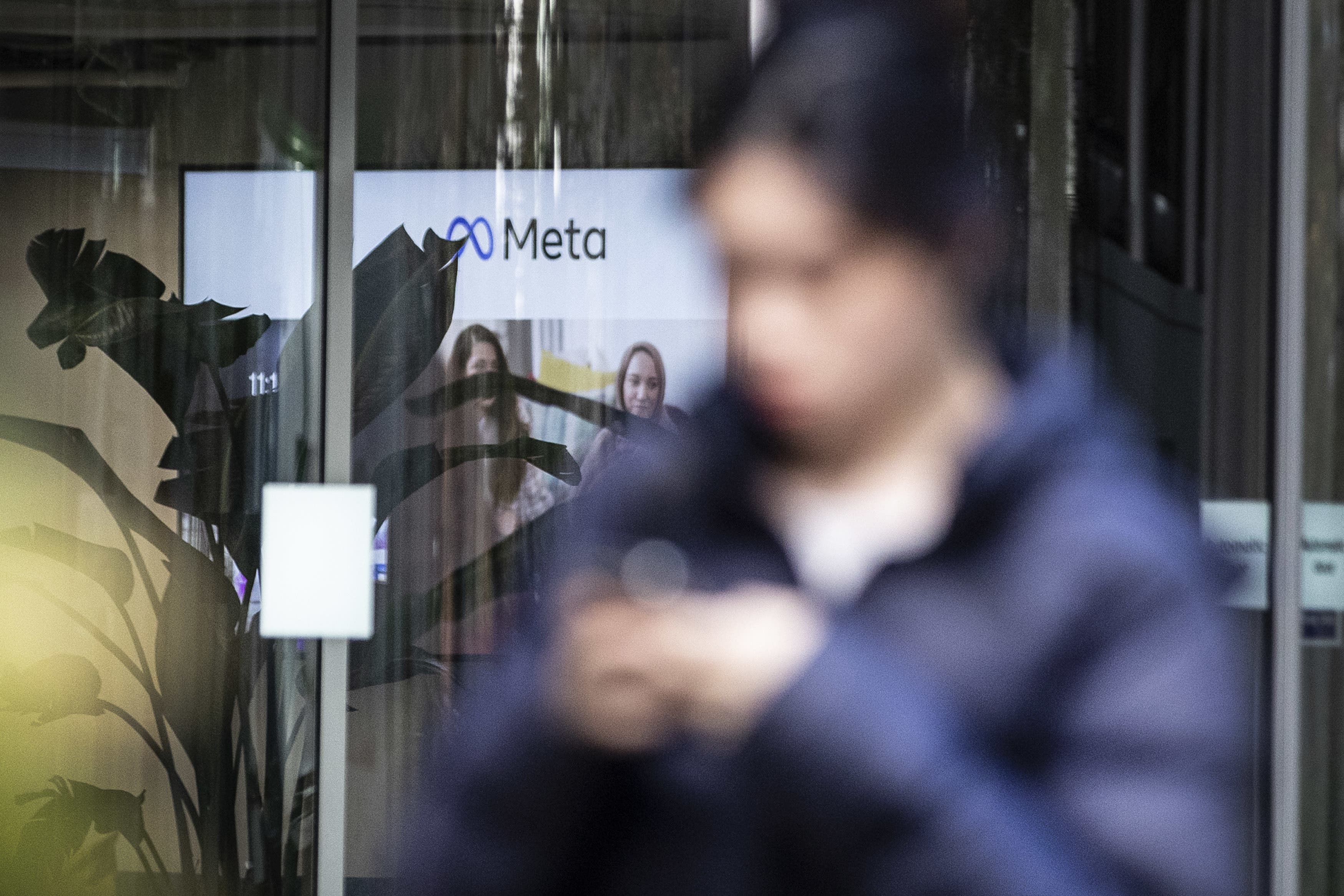 A person walking past the offices of Meta, the parent company of Facebook and Instagram, in King’s Cross, London. Meta has confirmed it plans to cut more than 11,000 jobs globally as part of a major restructuring of the tech giant. The cuts will reduce the size of the company’s workforce by about 13 percent. Picture date: Wednesday November 9, 2022.