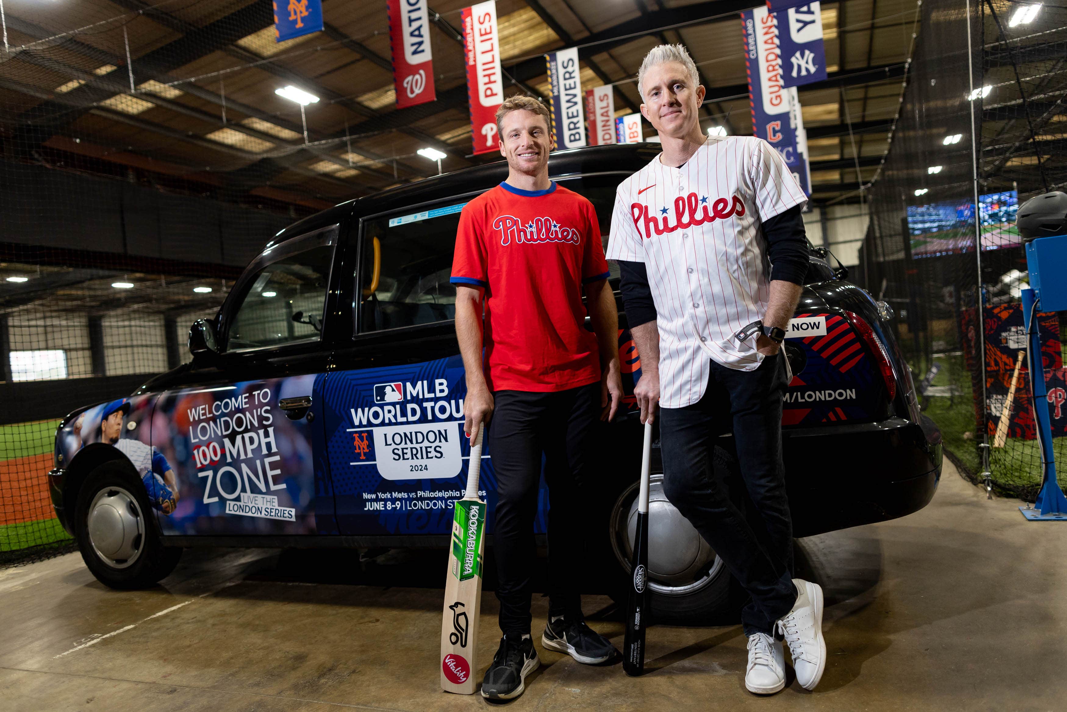 England white-ball captain Jos Buttler and former Philadelphia Phillies player Chase Utley (right) at The 108 to promote the MLB London series this summer (MLB Europe/Getty/Handout/PA)