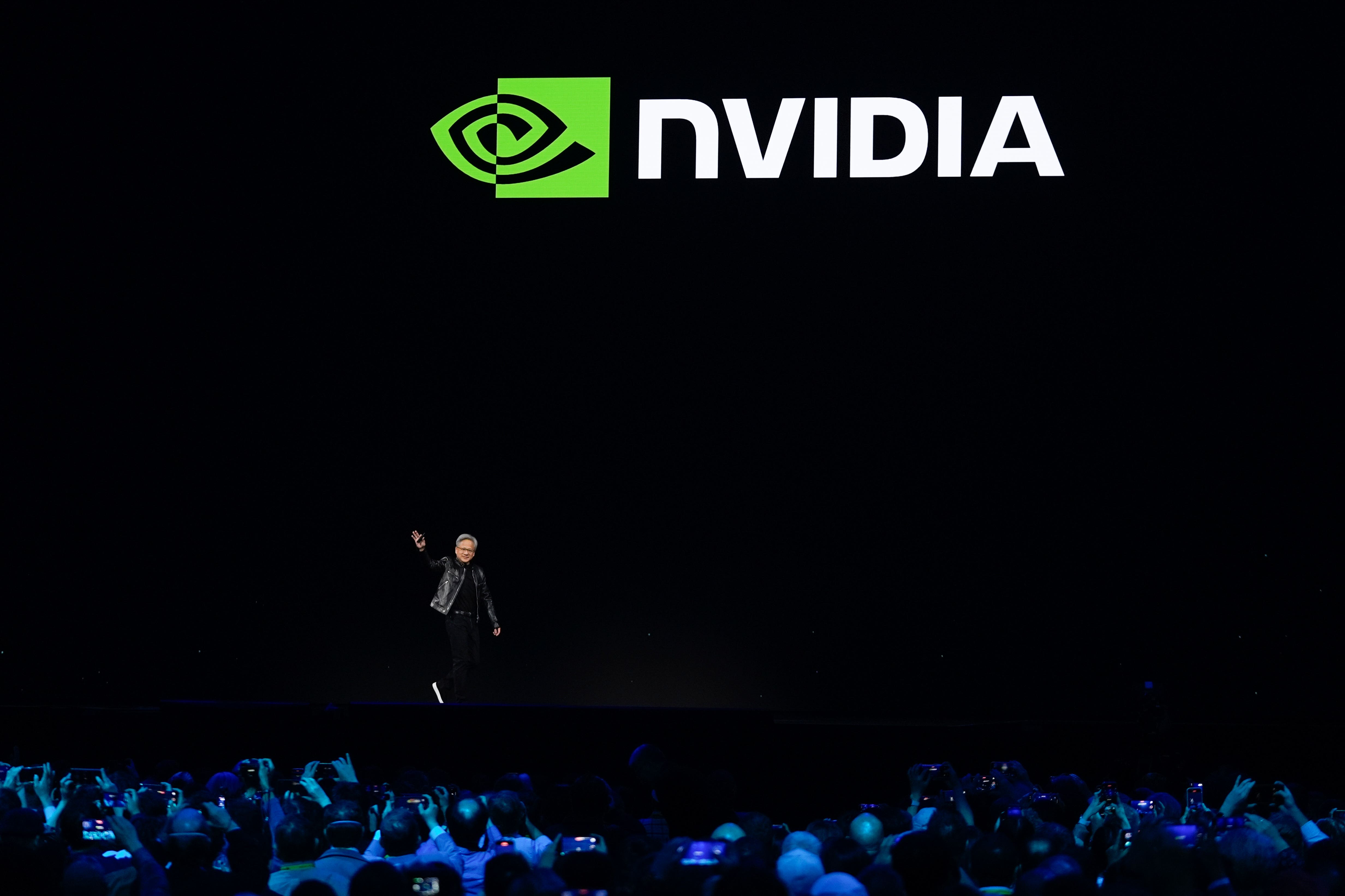 CEO Jensen Huang walks on stage before the keynote address of Nvidia GTC in San Jose, California (Eric Risberg/PA)