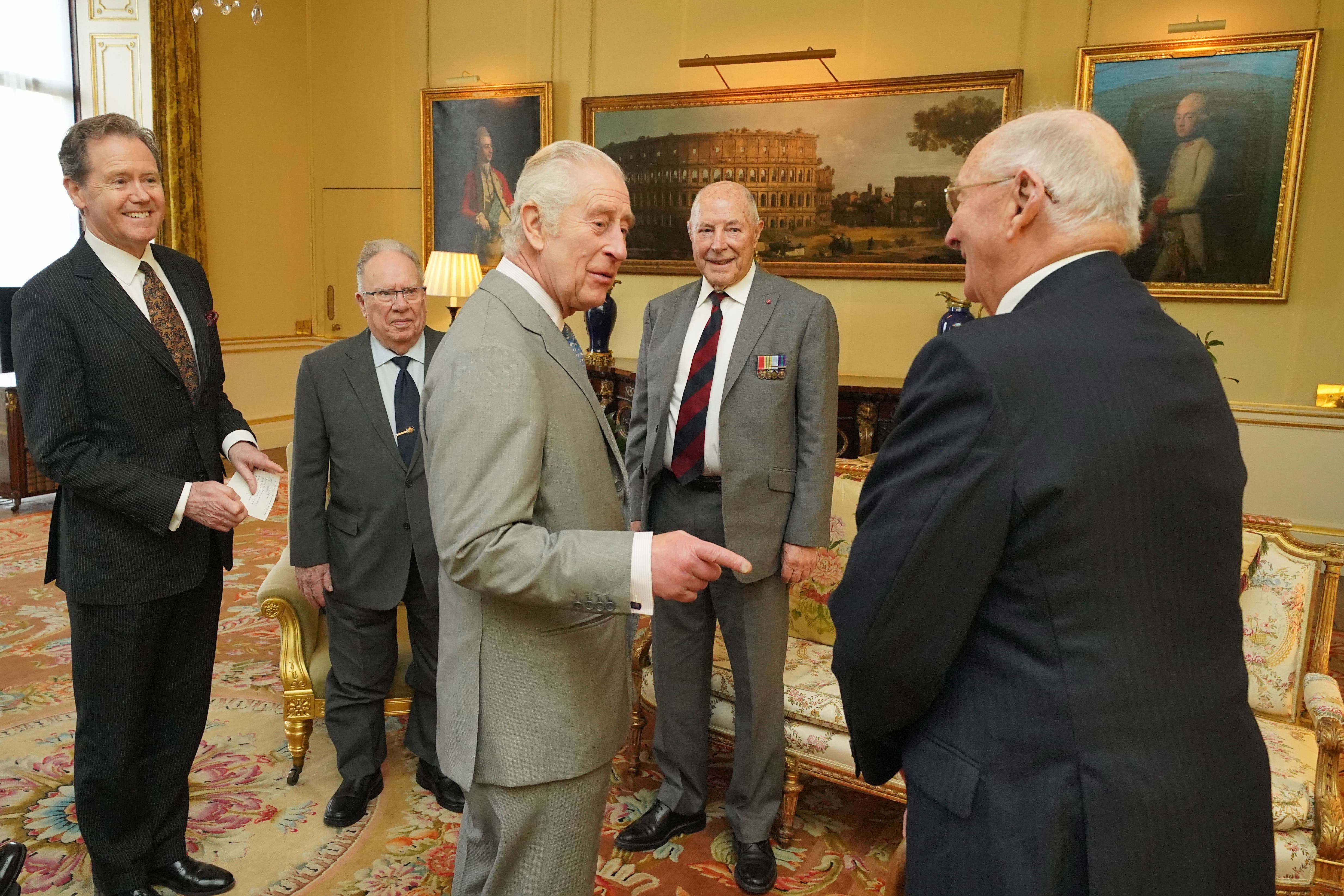 The King, along with Master of The King’s Household Vice Admiral Sir Tony Johnstone-Burt (left), during an audience with veterans of the Korean War Alan Guy, Mike Mogridge and Brian Parritt, at Buckingham Palace (Jonathan Brady/PA)