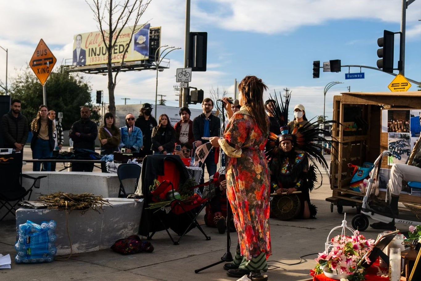 Community organiser Carla Orendorff address a memorial event in Van Nuys