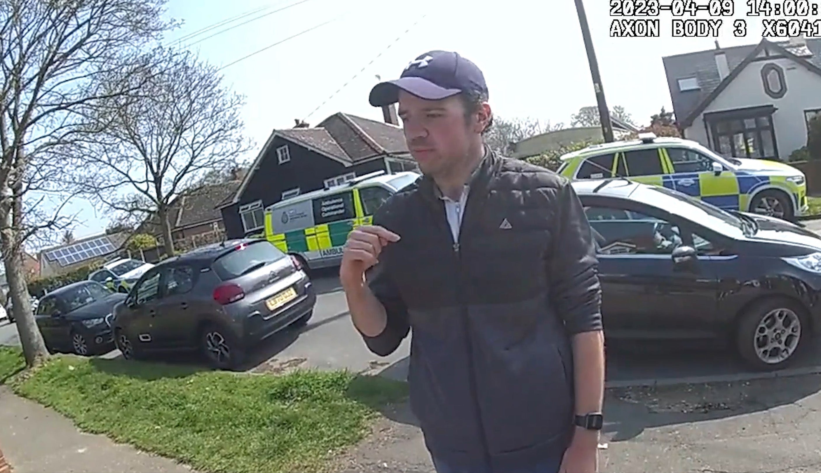 Luke D'Wit providing statements to the police outside Victory Road on Mersea Island